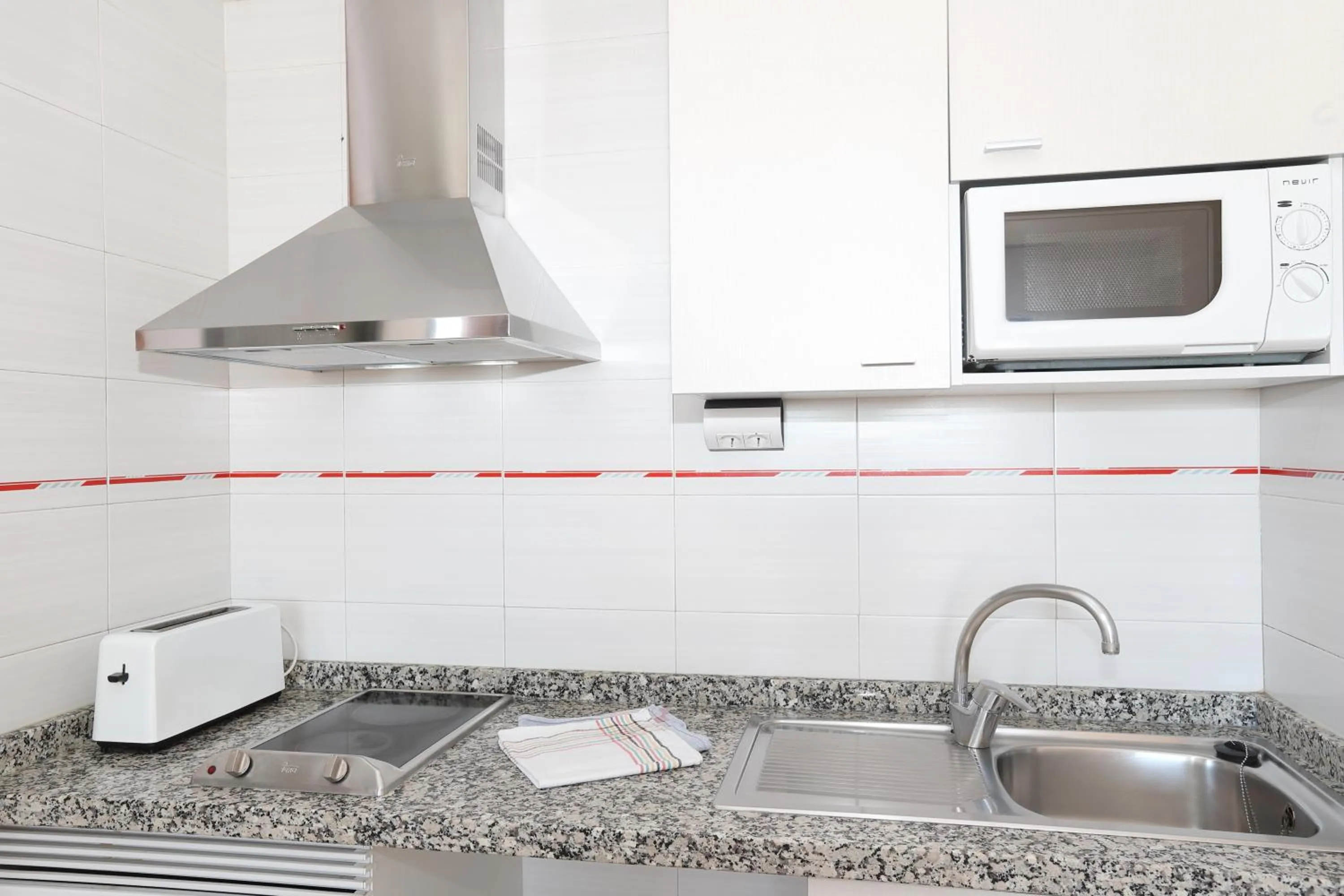 Kitchen or kitchenette in La Caseta Apartments