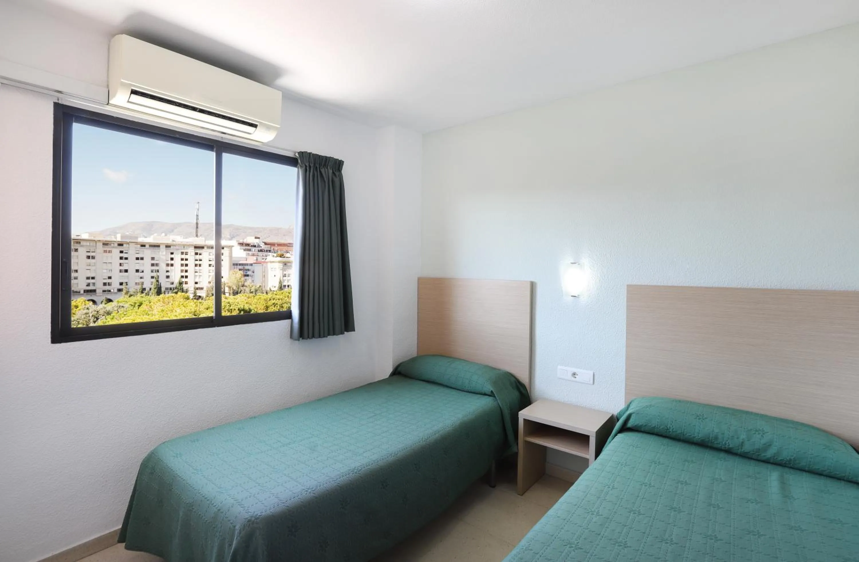 Bed in La Caseta Apartments