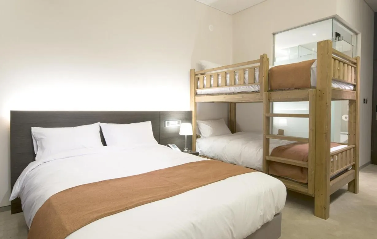 Bed in Grand Mer Hotel Seogwipo Ocean