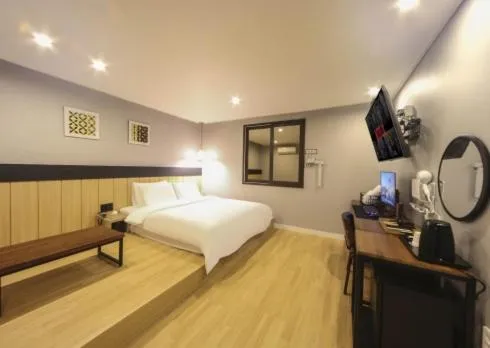 Bed in The Stone Bridge Hotel Sasang