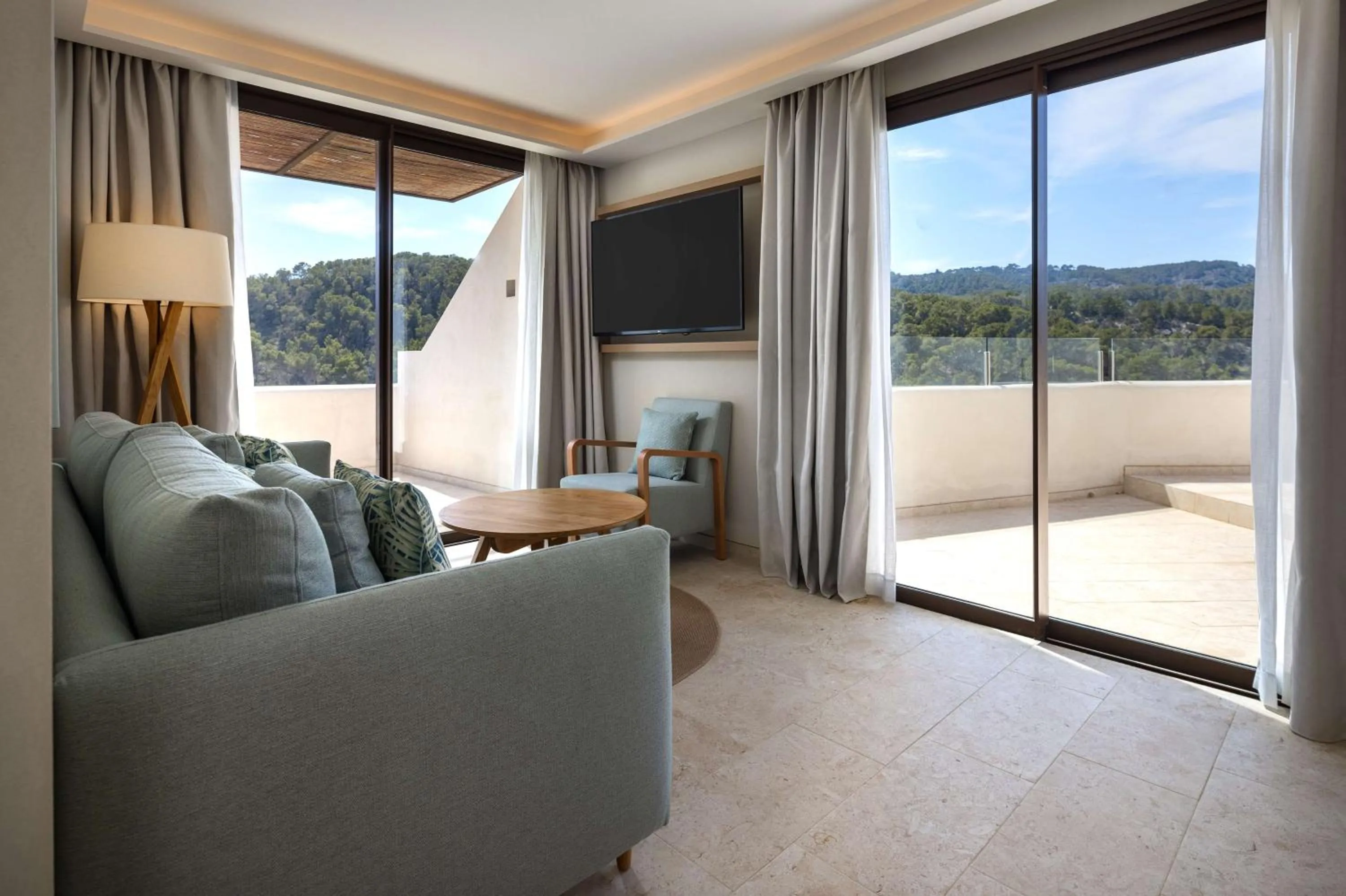 Living room in Cala San Miguel Hotel Ibiza, Curio Collection by Hilton, Adults only