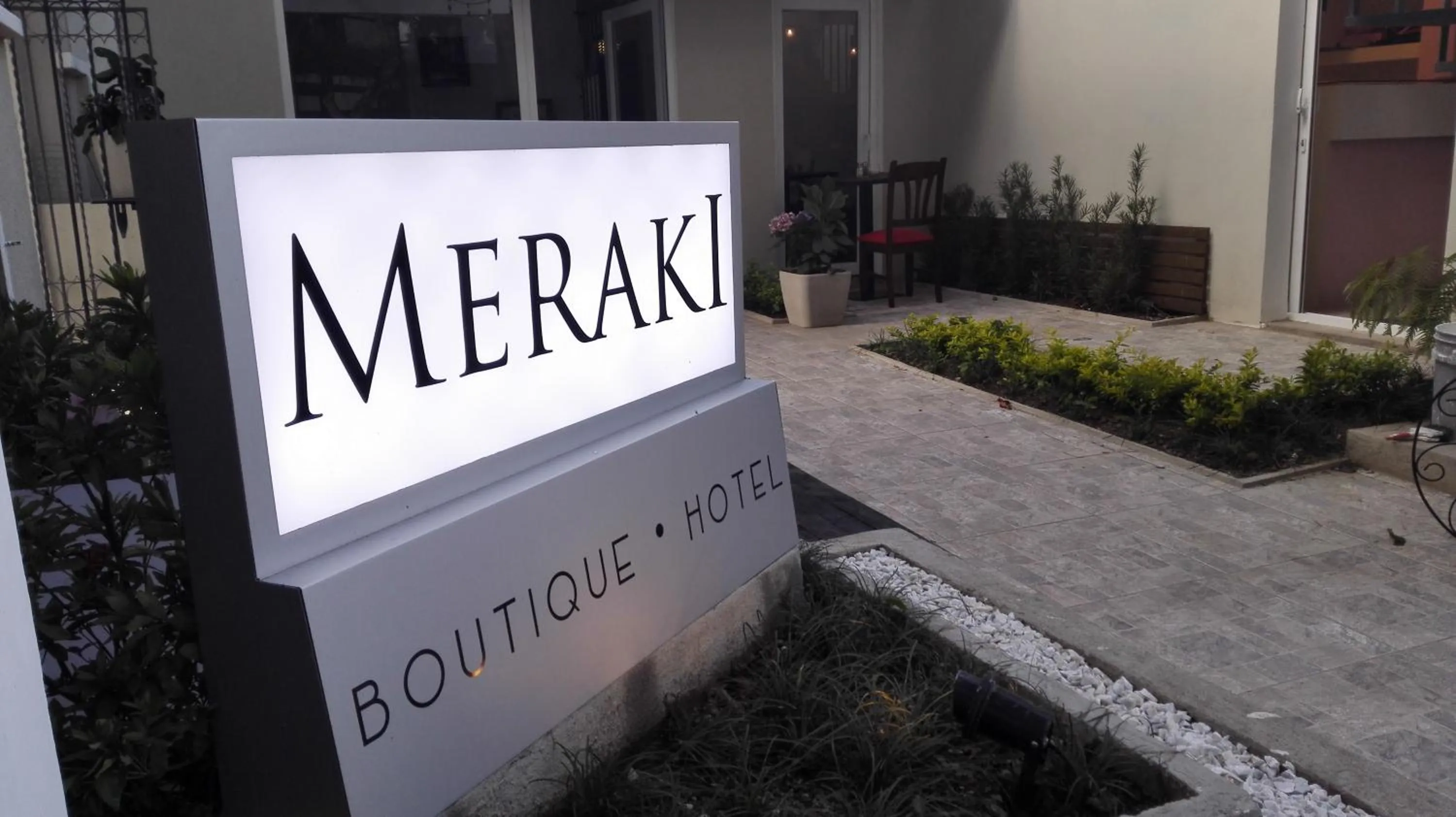 Property logo or sign in Meraki Boutique Hotel