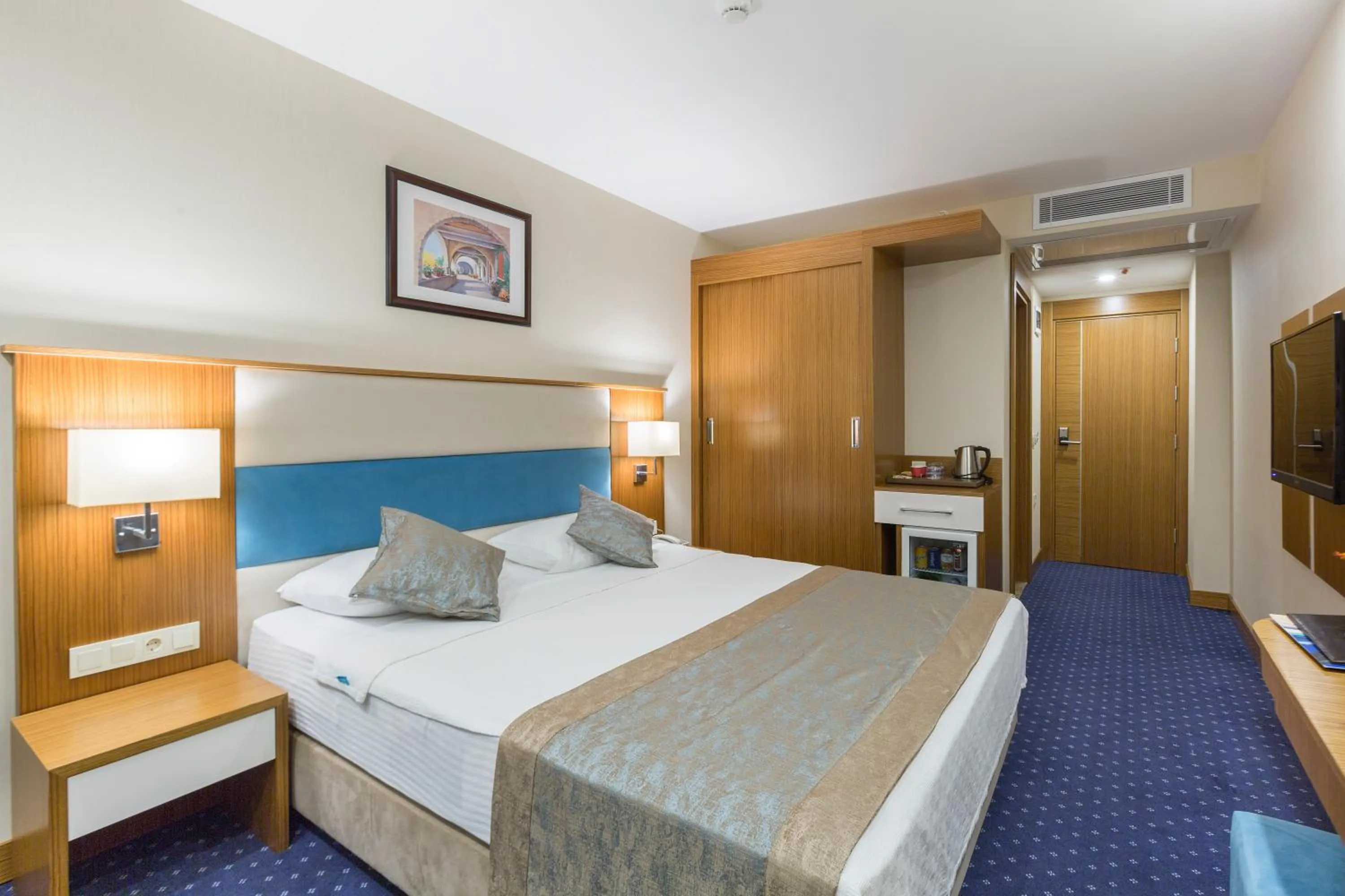 Bed in Marpessa Blue Beach Resort & SPA Hotel