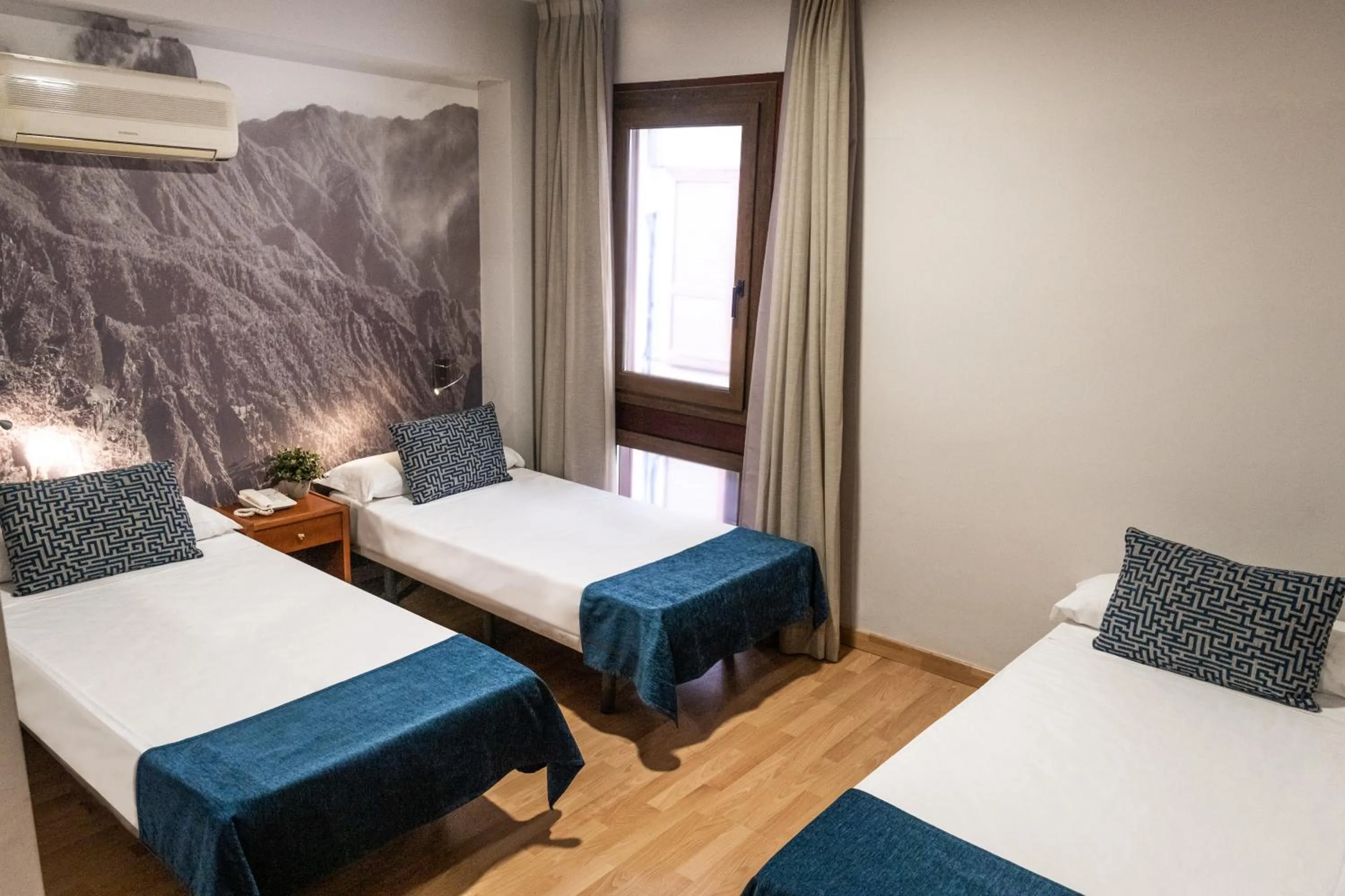 Bed in Hotel Adonis Plaza