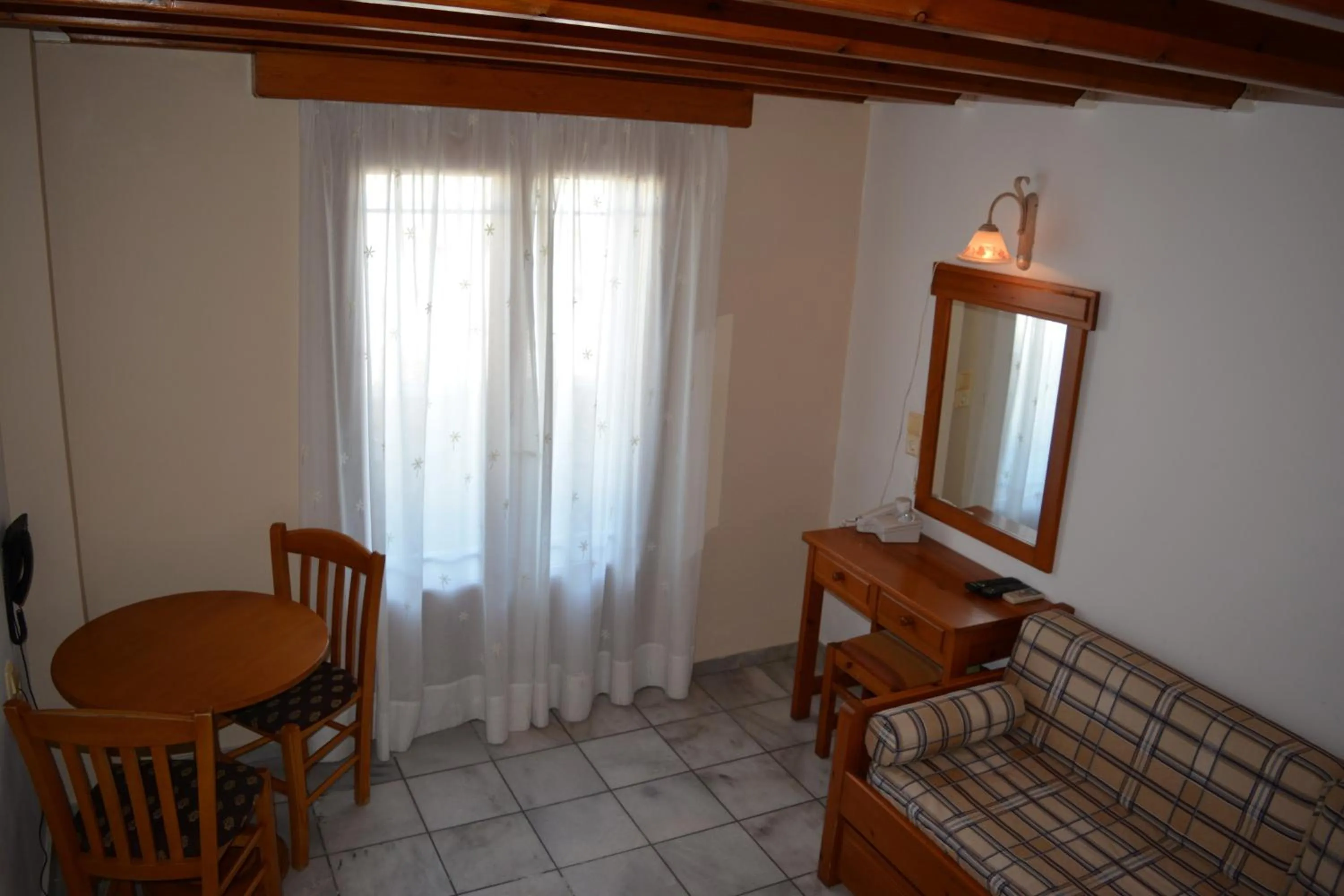 Bed in Anemomilos Suites