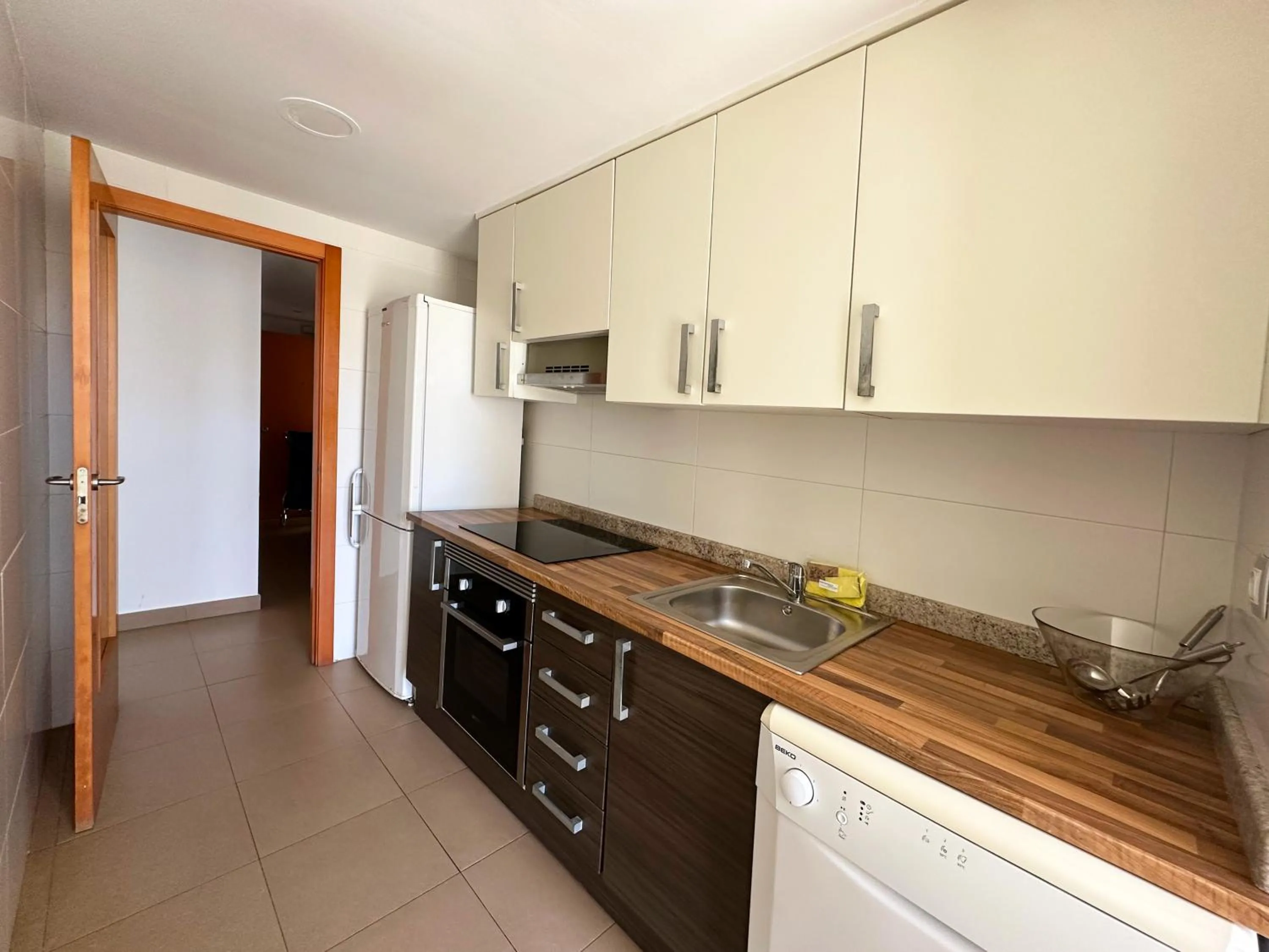 Kitchen or kitchenette in Apartamentos Alcocebre Suites 3000