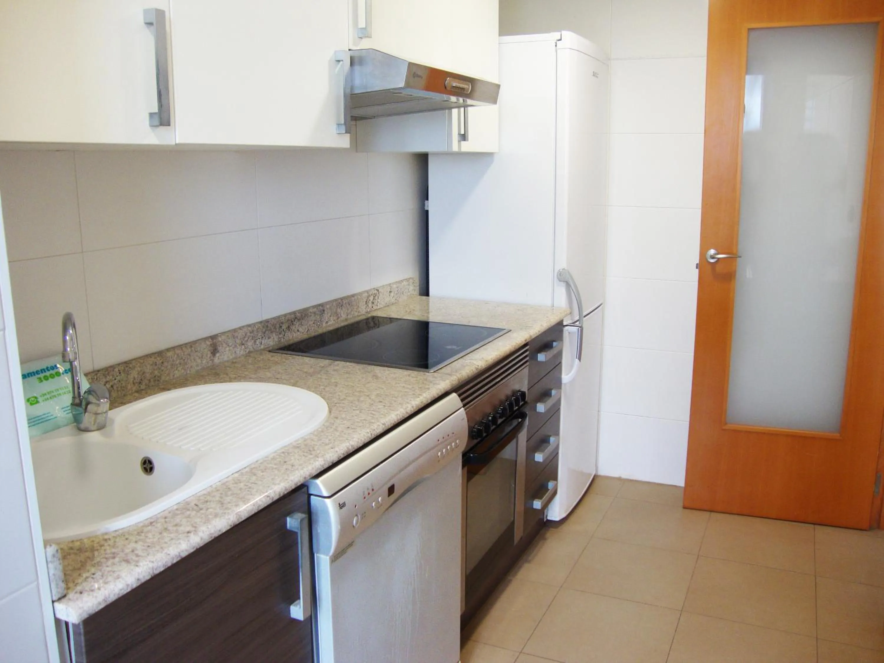 Kitchen or kitchenette in Apartamentos Alcocebre Suites 3000