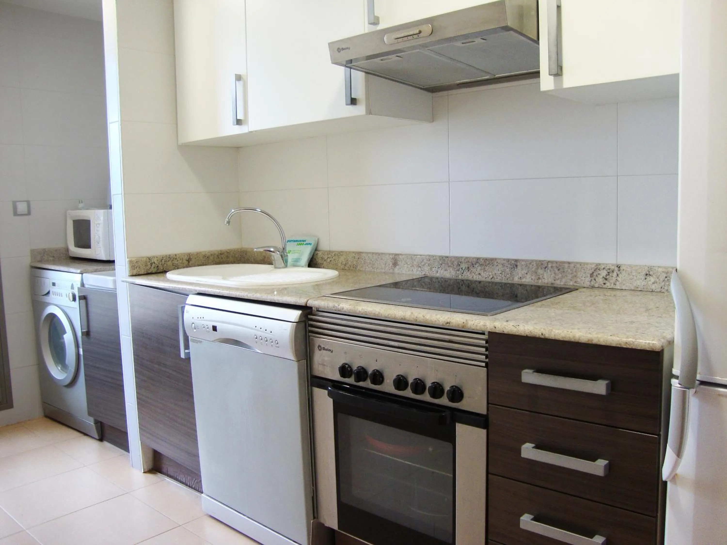 Kitchen or kitchenette in Apartamentos Alcocebre Suites 3000