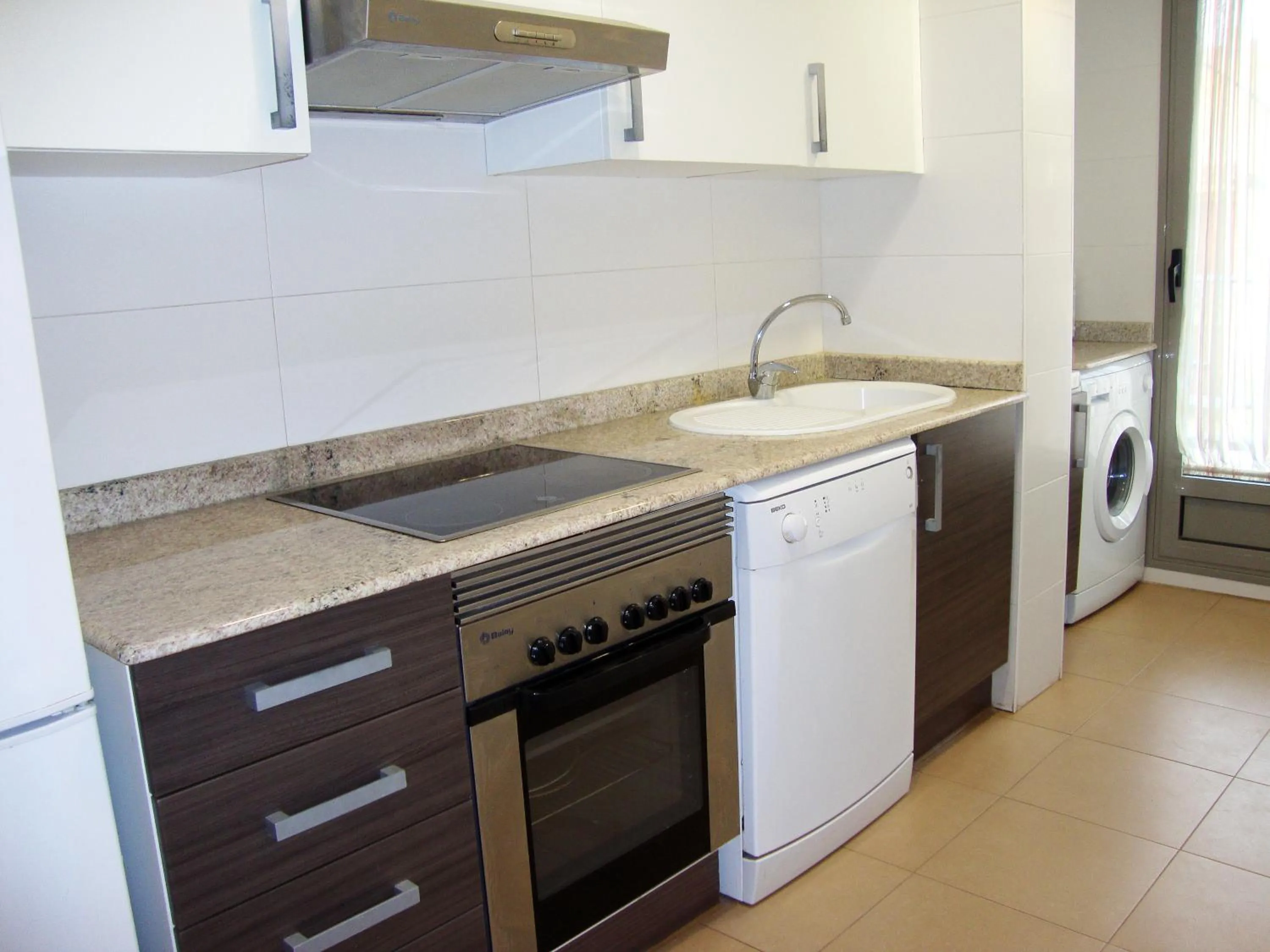 Kitchen or kitchenette in Apartamentos Alcocebre Suites 3000