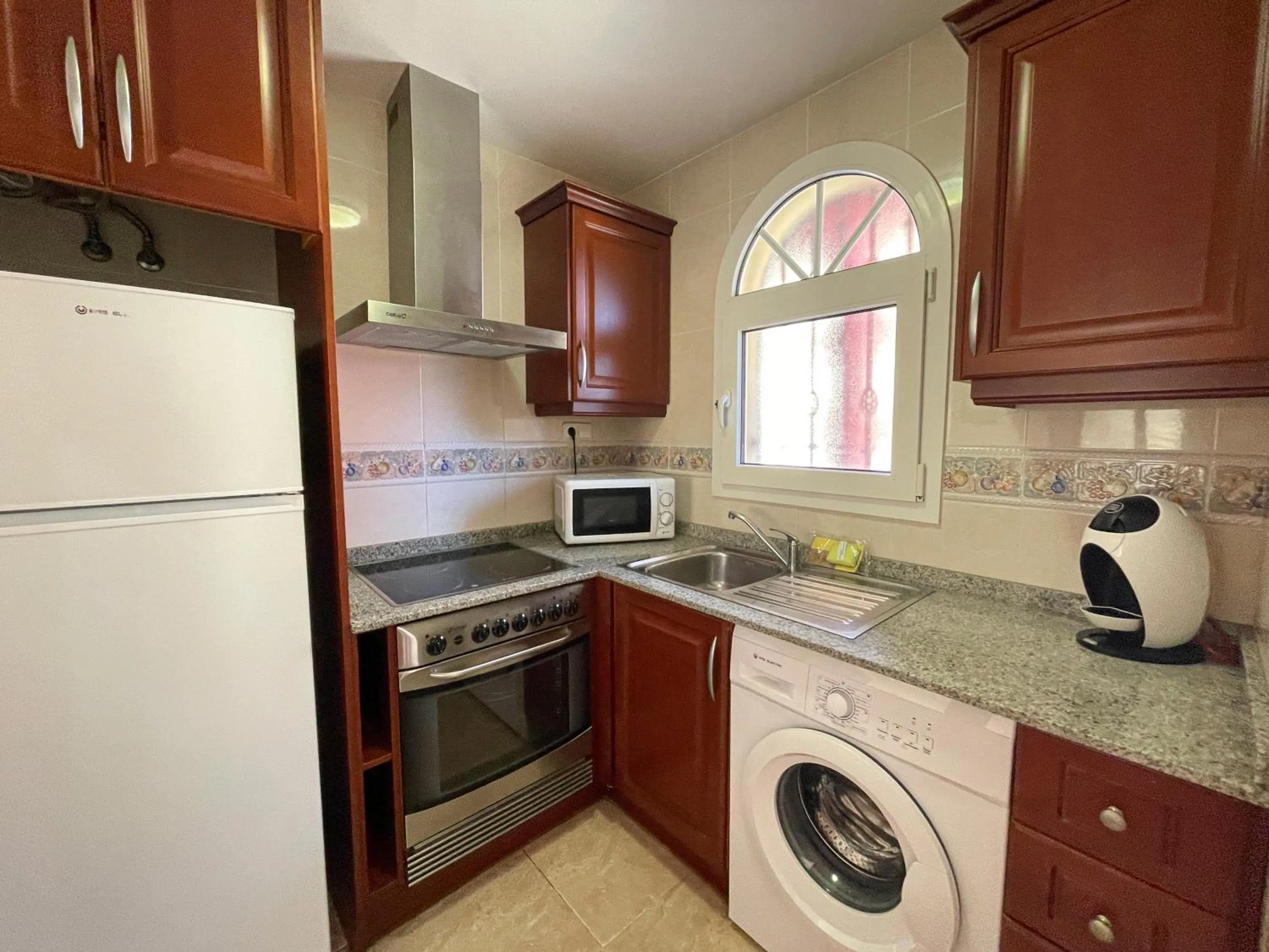 Kitchen or kitchenette in Apartamentos Madeira 3000