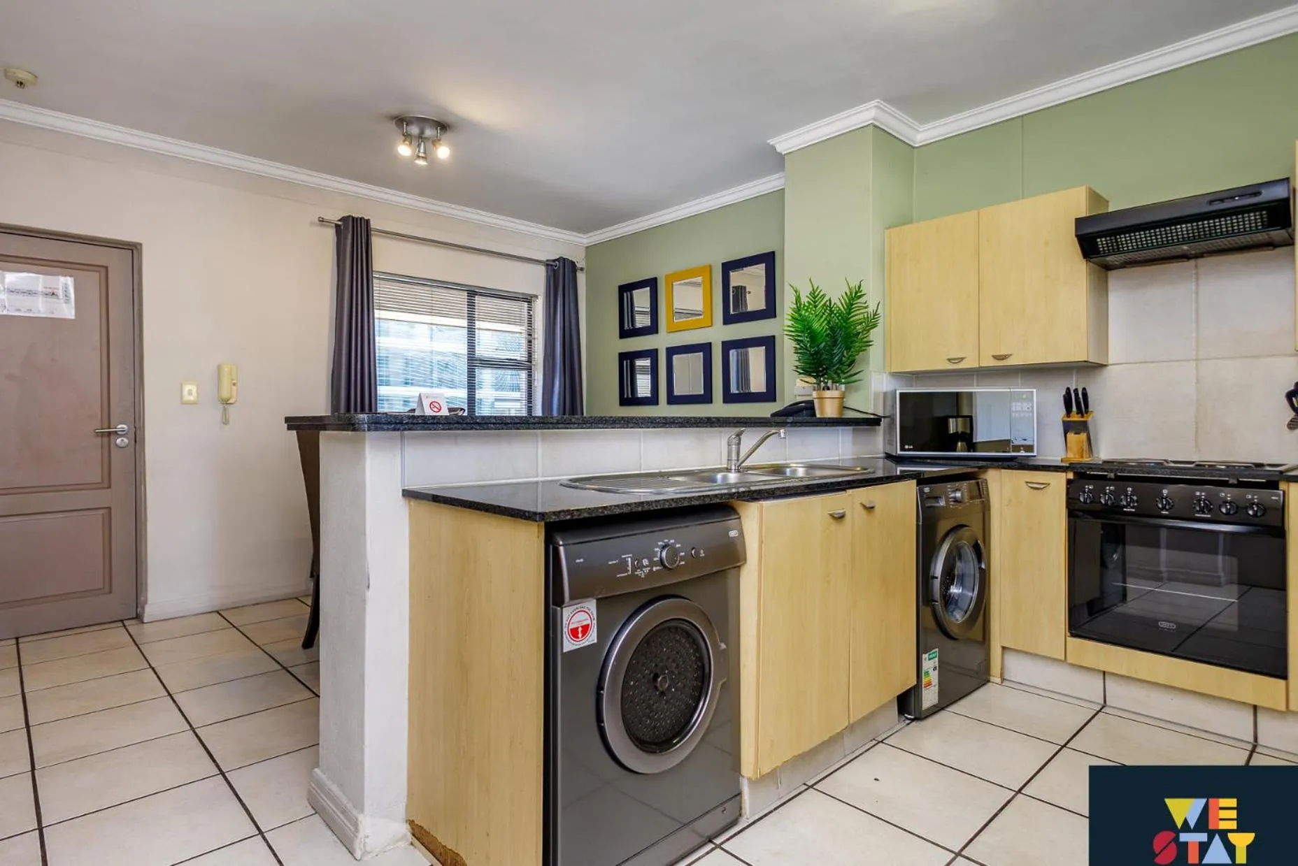 Kitchen or kitchenette in WeStay Westpoint Apartments