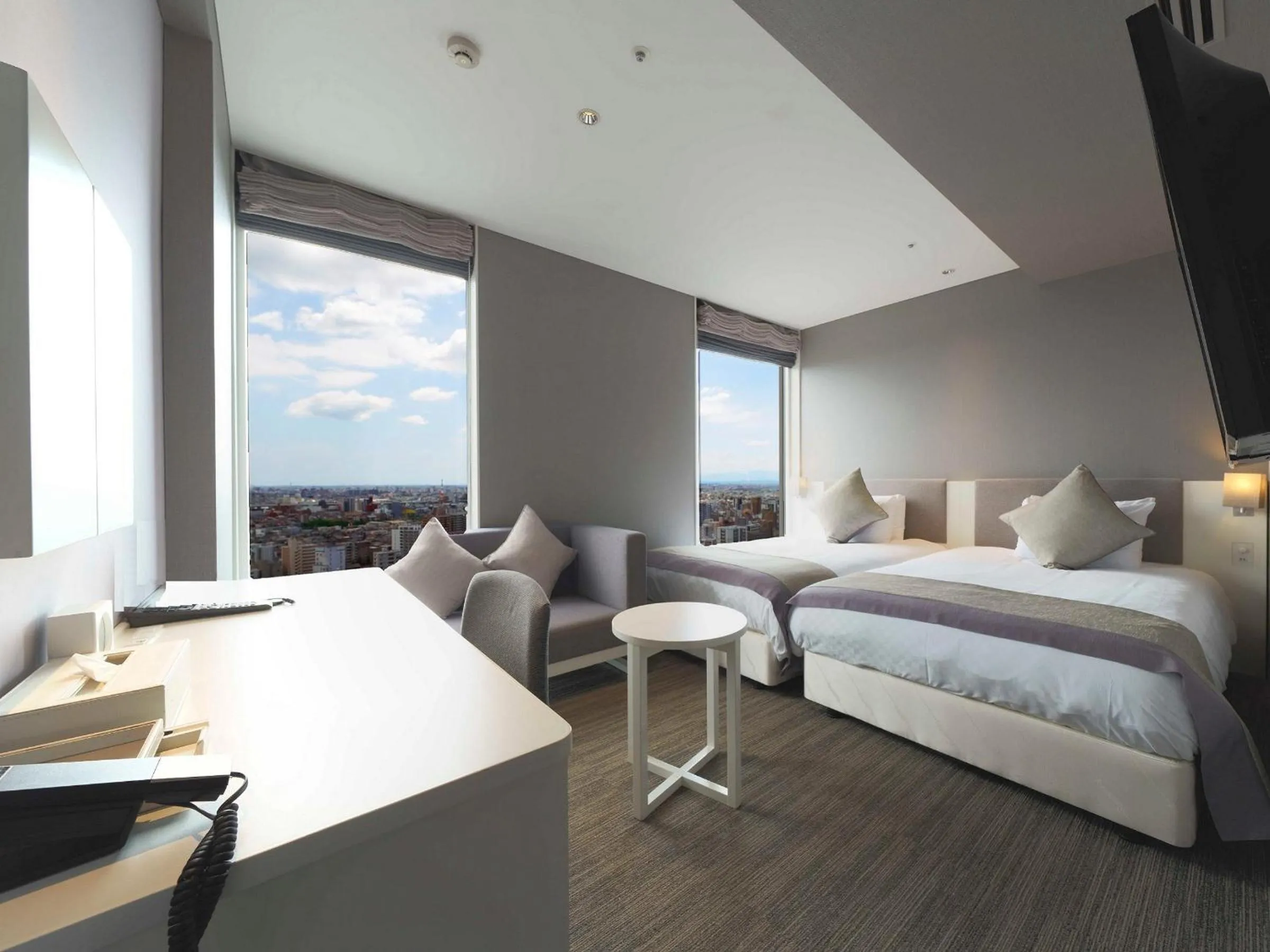 Bed in Meitetsu Inn Nagoyaeki Shinkansenguchi