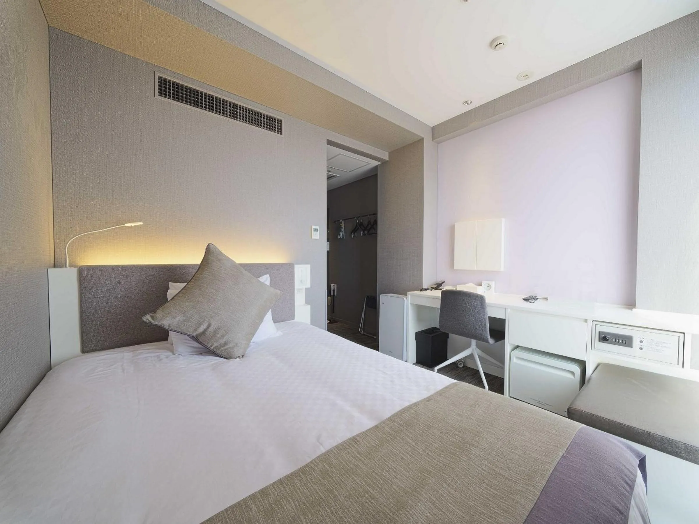 Bed in Meitetsu Inn Nagoyaeki Shinkansenguchi