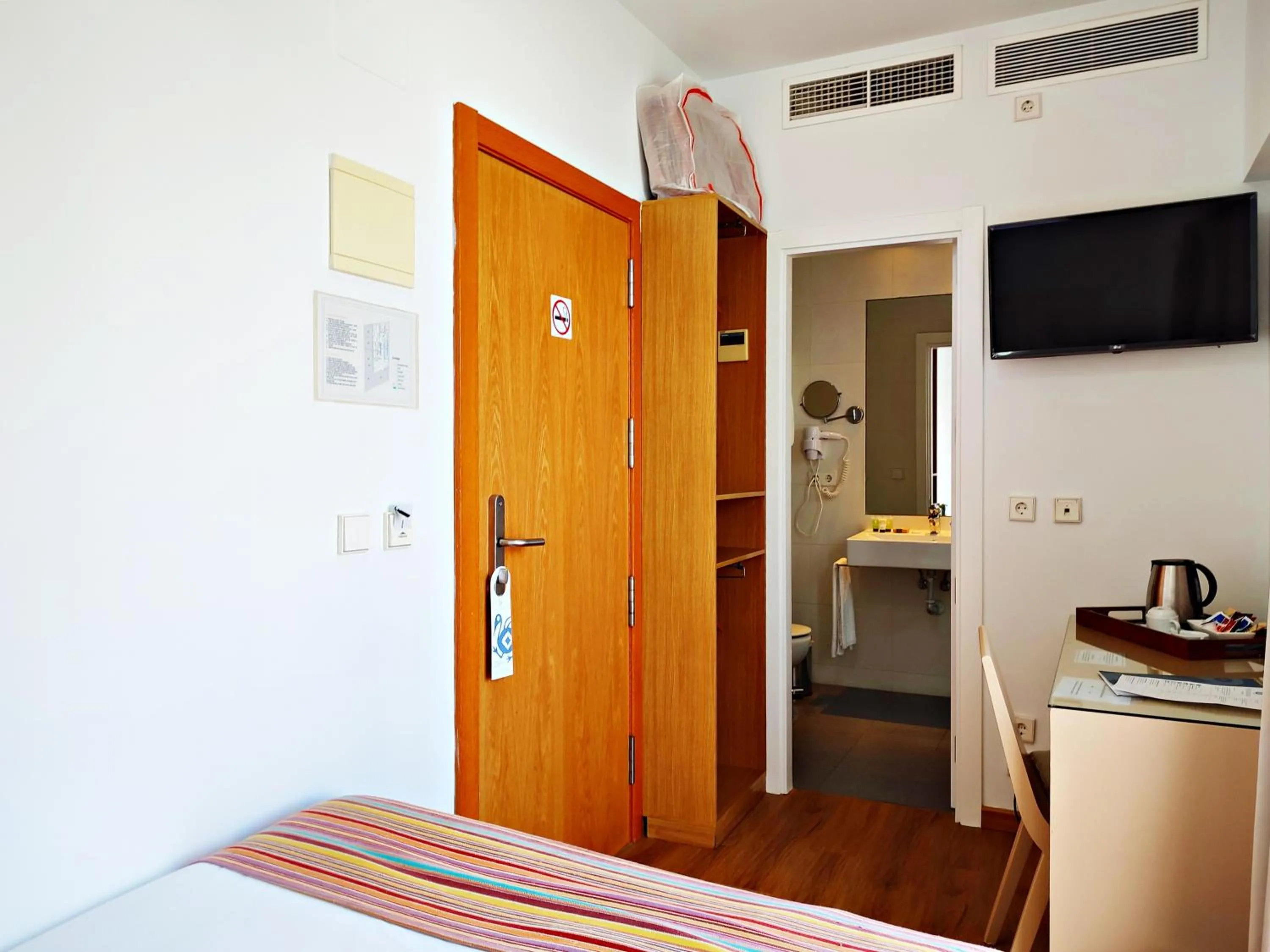 Bed in Hotel Apartamentos Patagonia Sur