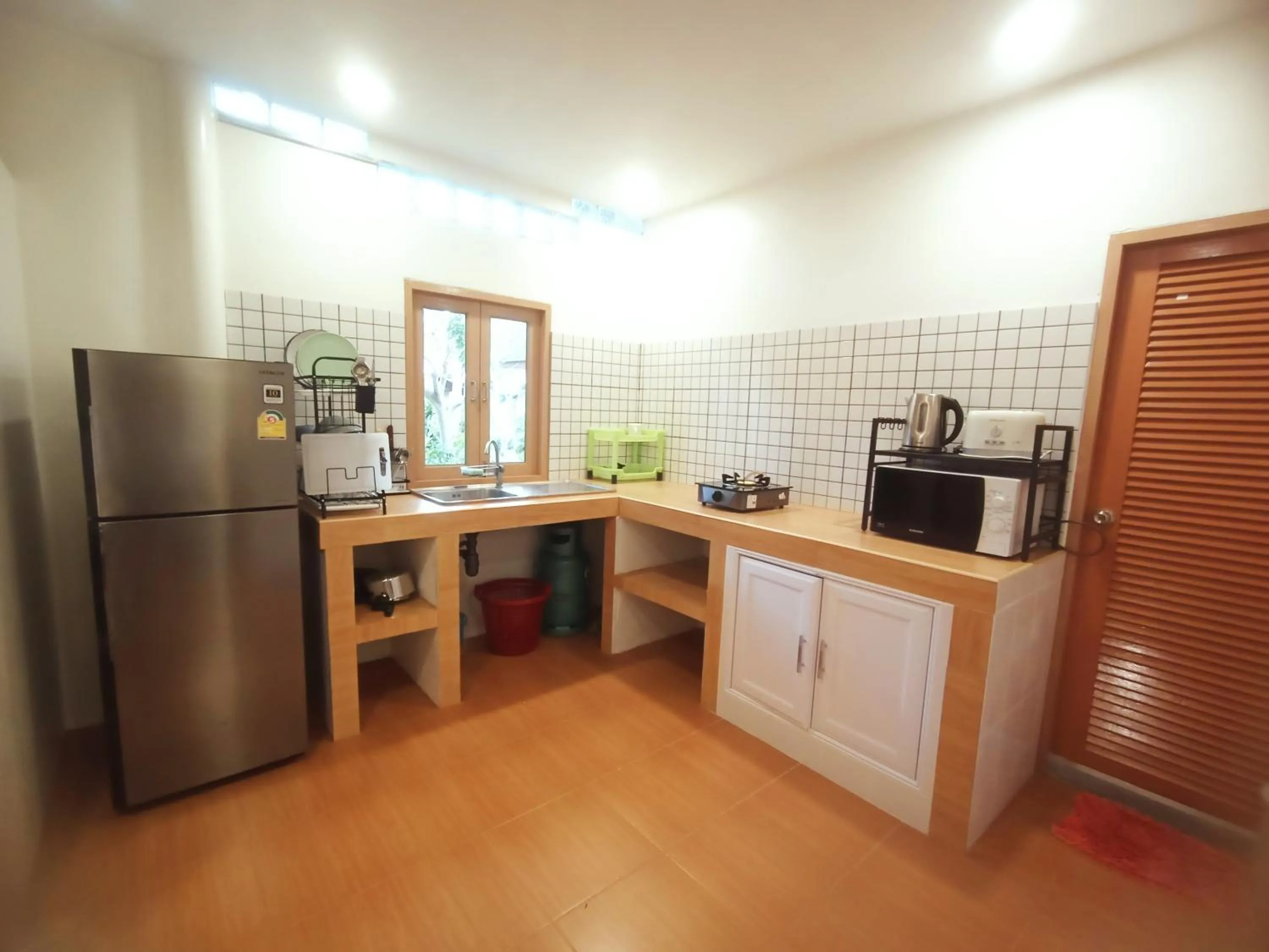 Kitchen or kitchenette in Baan Moonchan House