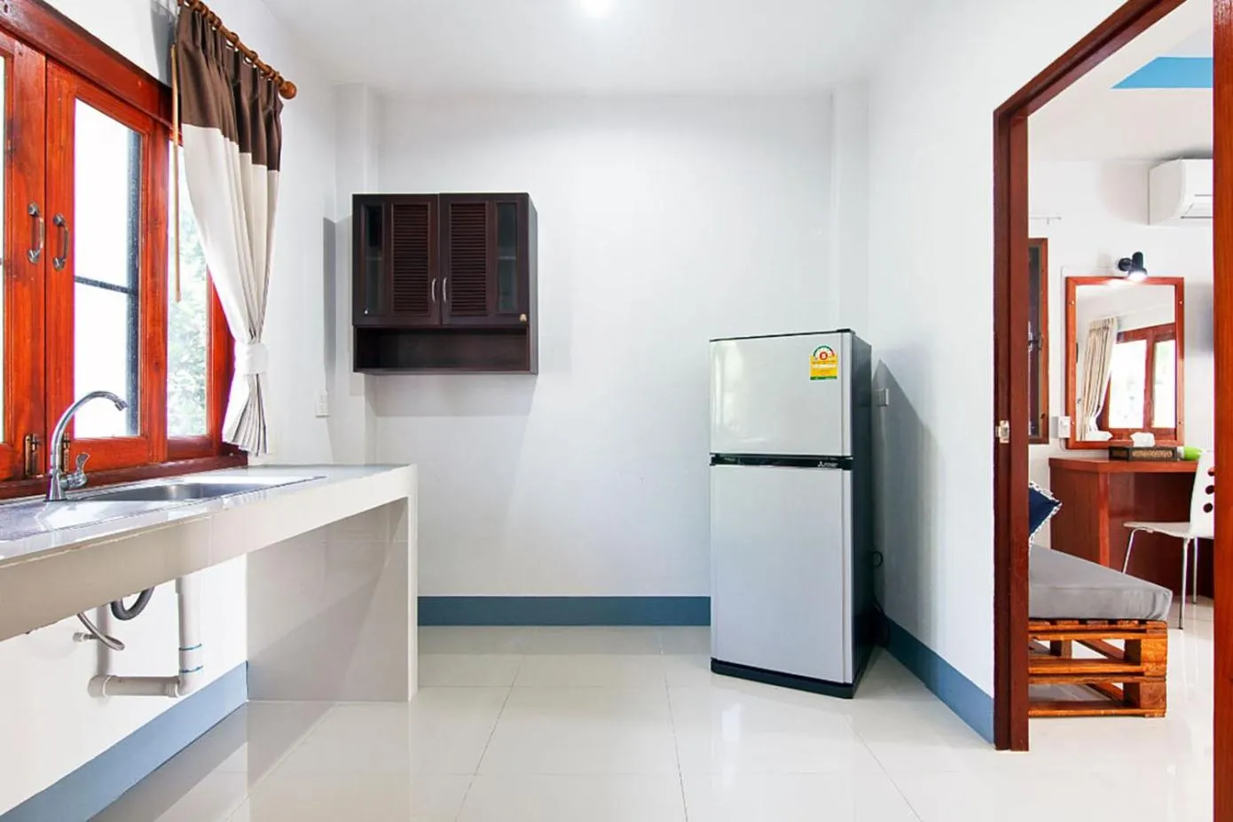 Communal lounge/ TV room in Breeze Bay Villas Koh Phangan