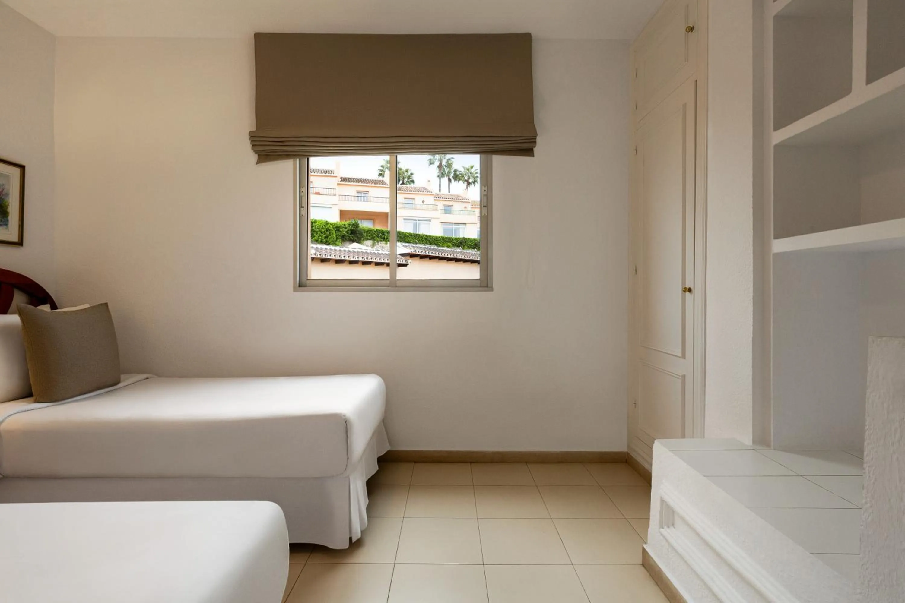 Bed in Ramada Hotel & Suites by Wyndham Costa del Sol