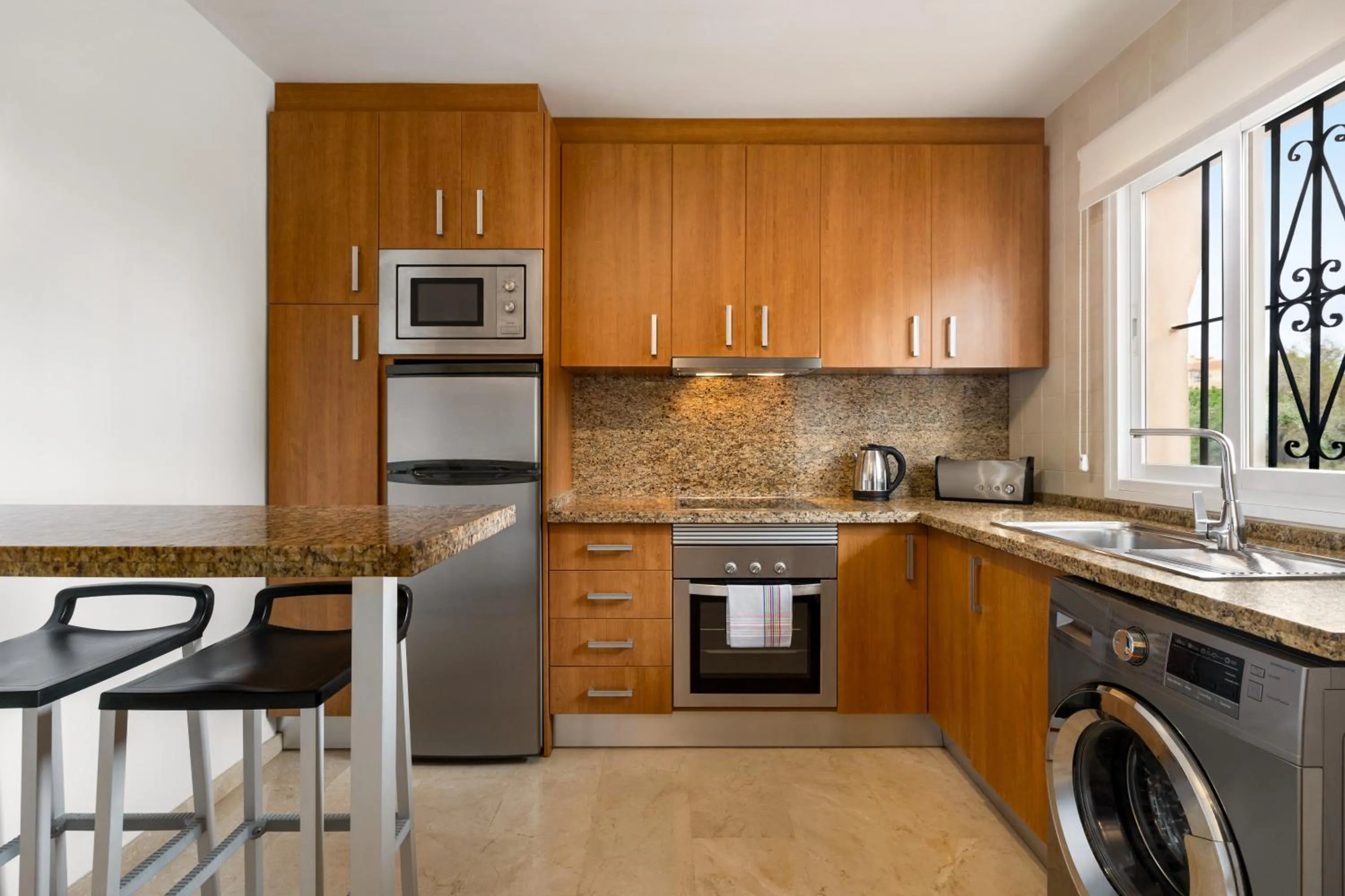 kitchen in Ramada Hotel & Suites by Wyndham Costa del Sol