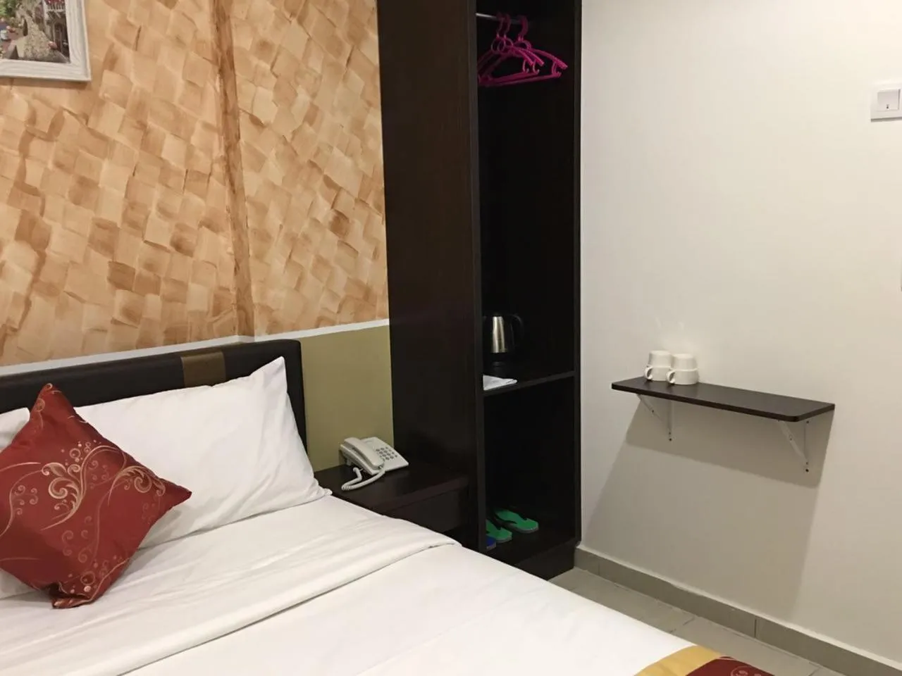 Bed in Global Inn Hotel