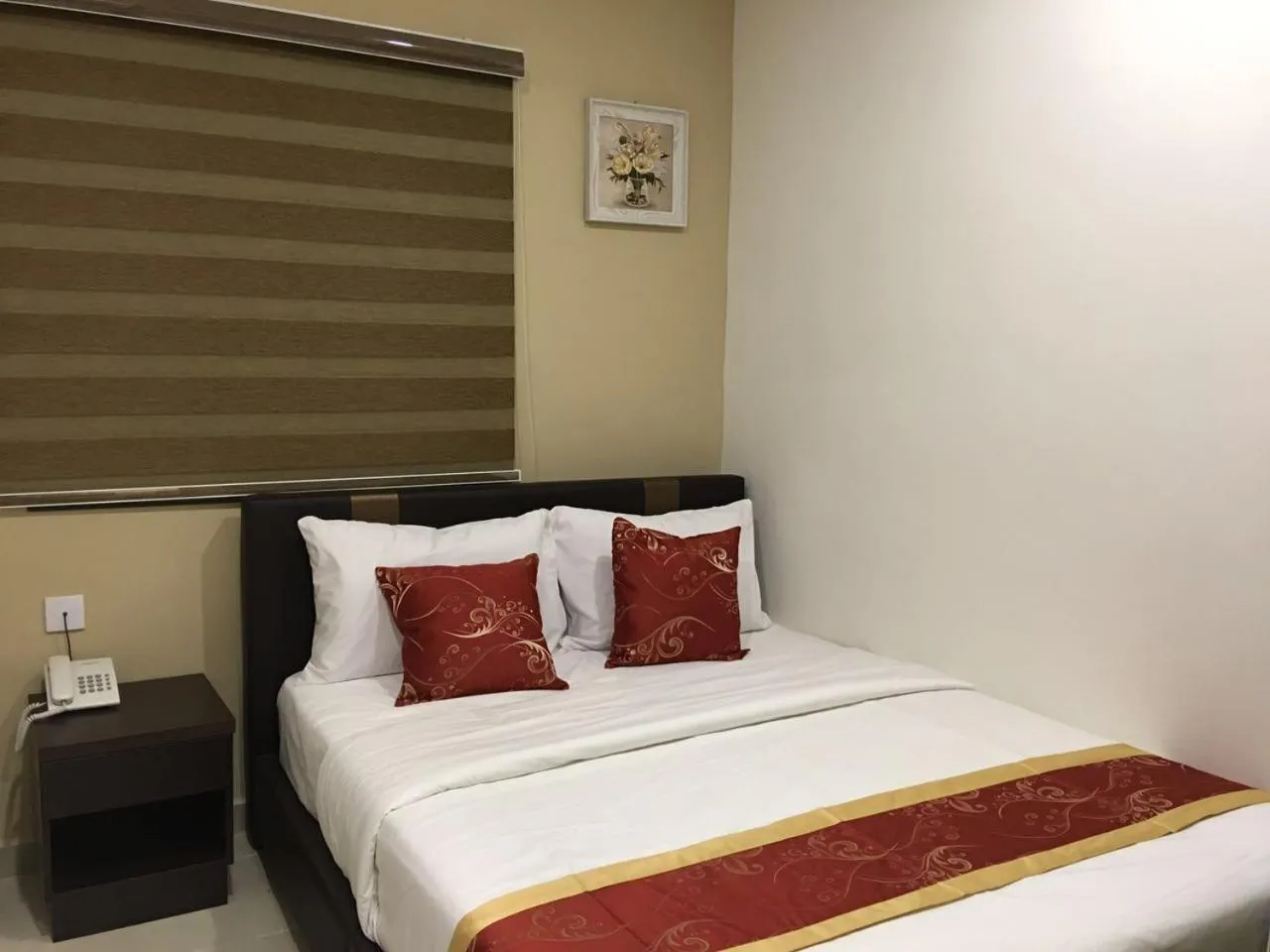 Bed in Global Inn Hotel