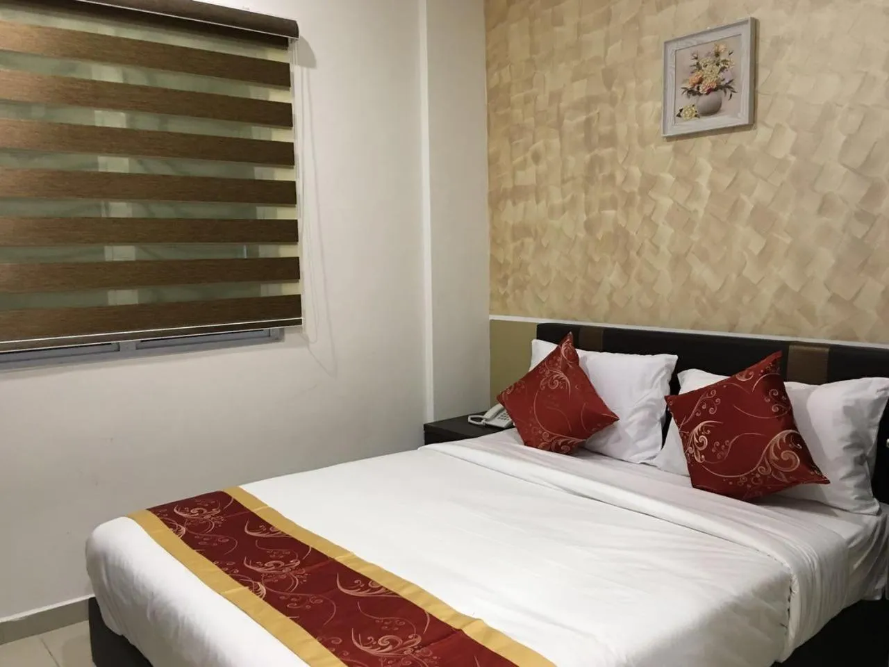 Bed in Global Inn Hotel