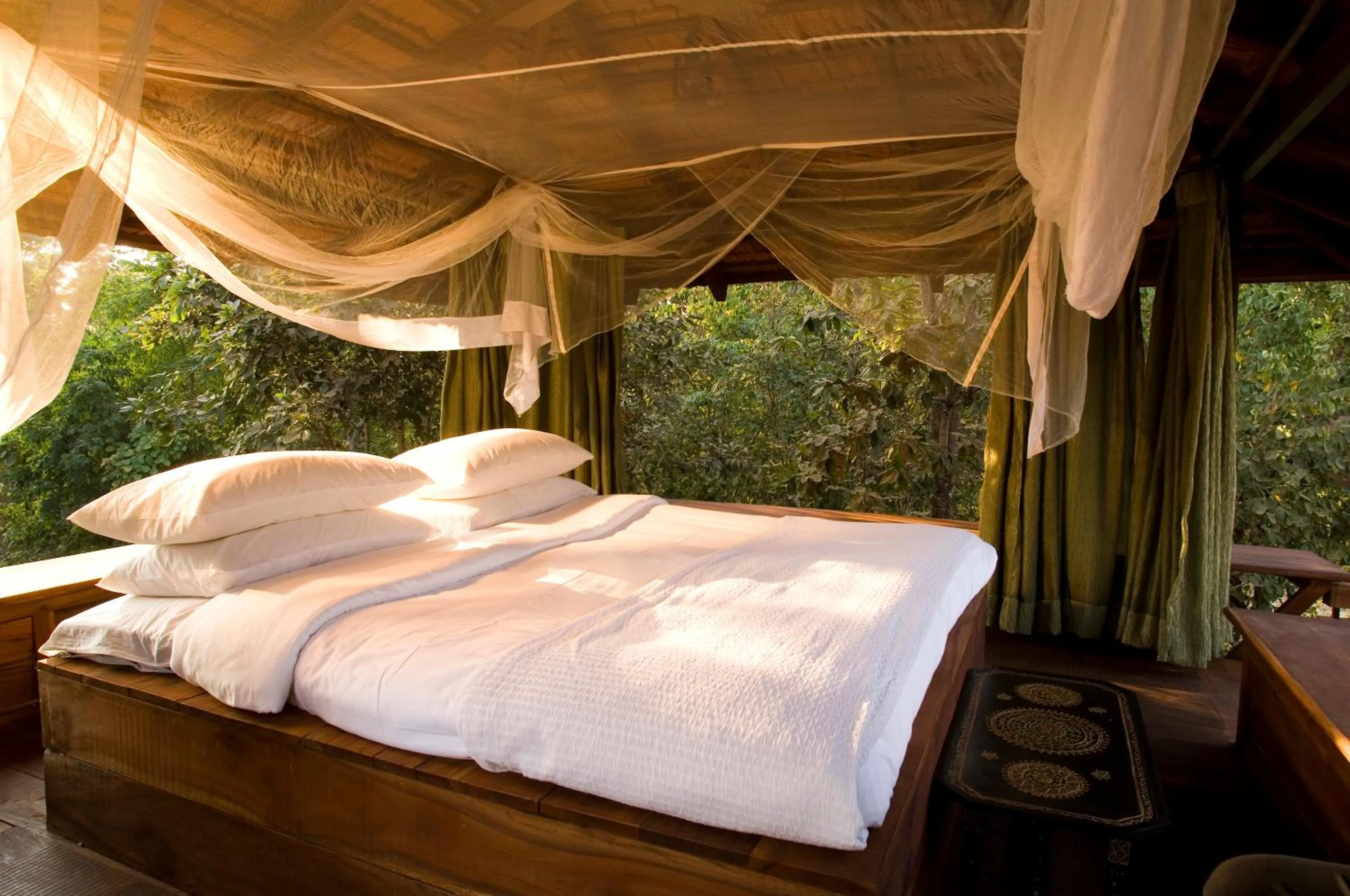 Bedroom, Bed in Baghvan Pench National Park - A Taj Safari Lodge