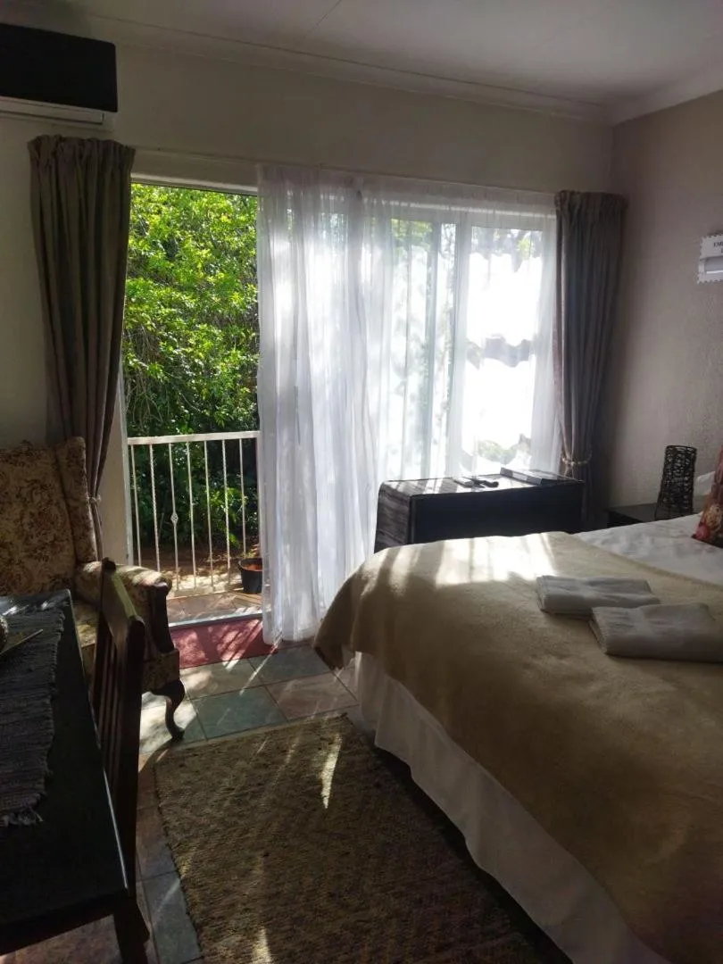 Bed in Ukarimu Guest House