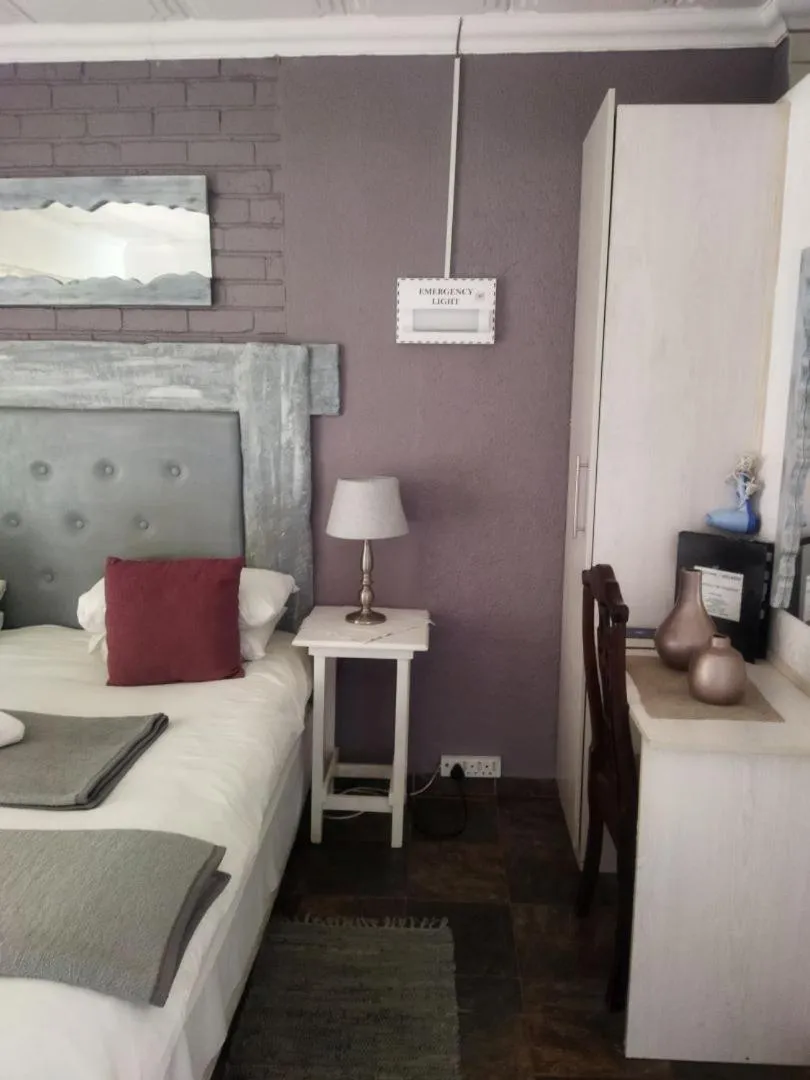 Bed in Ukarimu Guest House