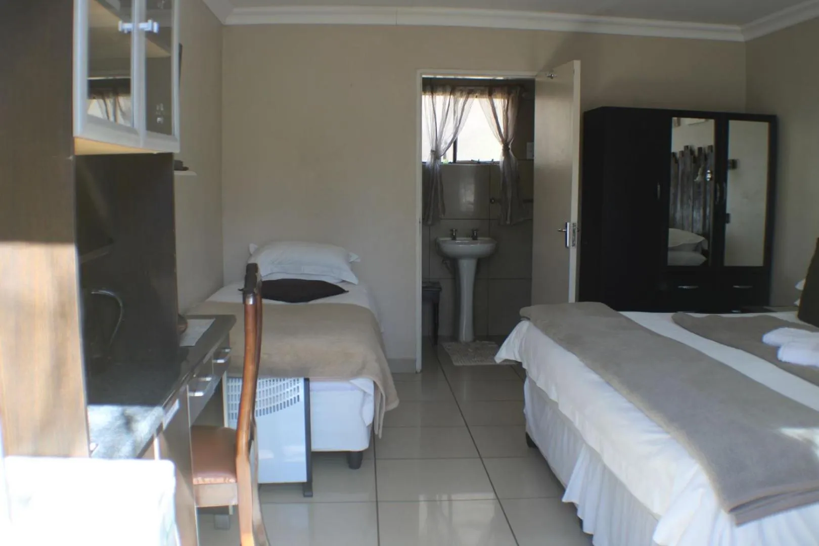 Bed in Ukarimu Guest House