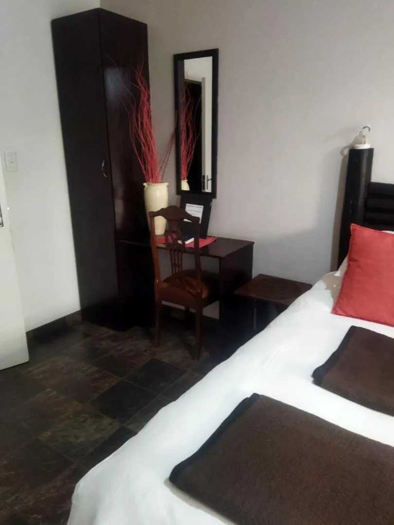 Bed in Ukarimu Guest House