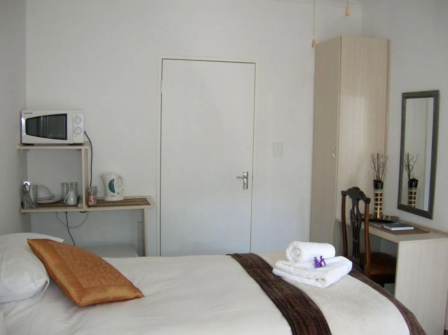 Bed in Ukarimu Guest House