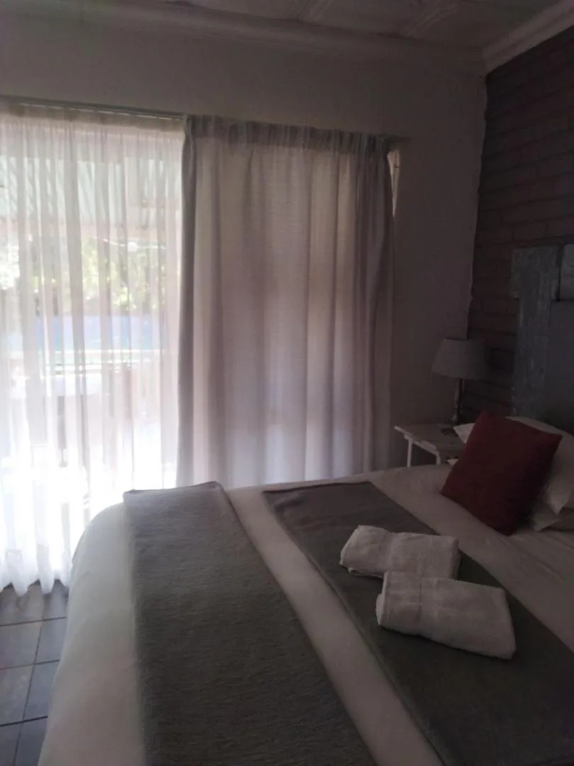 Bed in Ukarimu Guest House