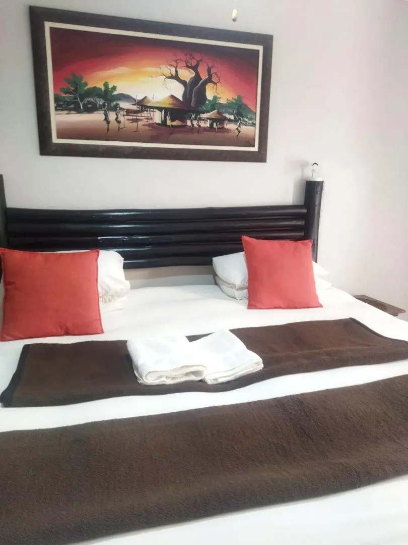 Bed in Ukarimu Guest House