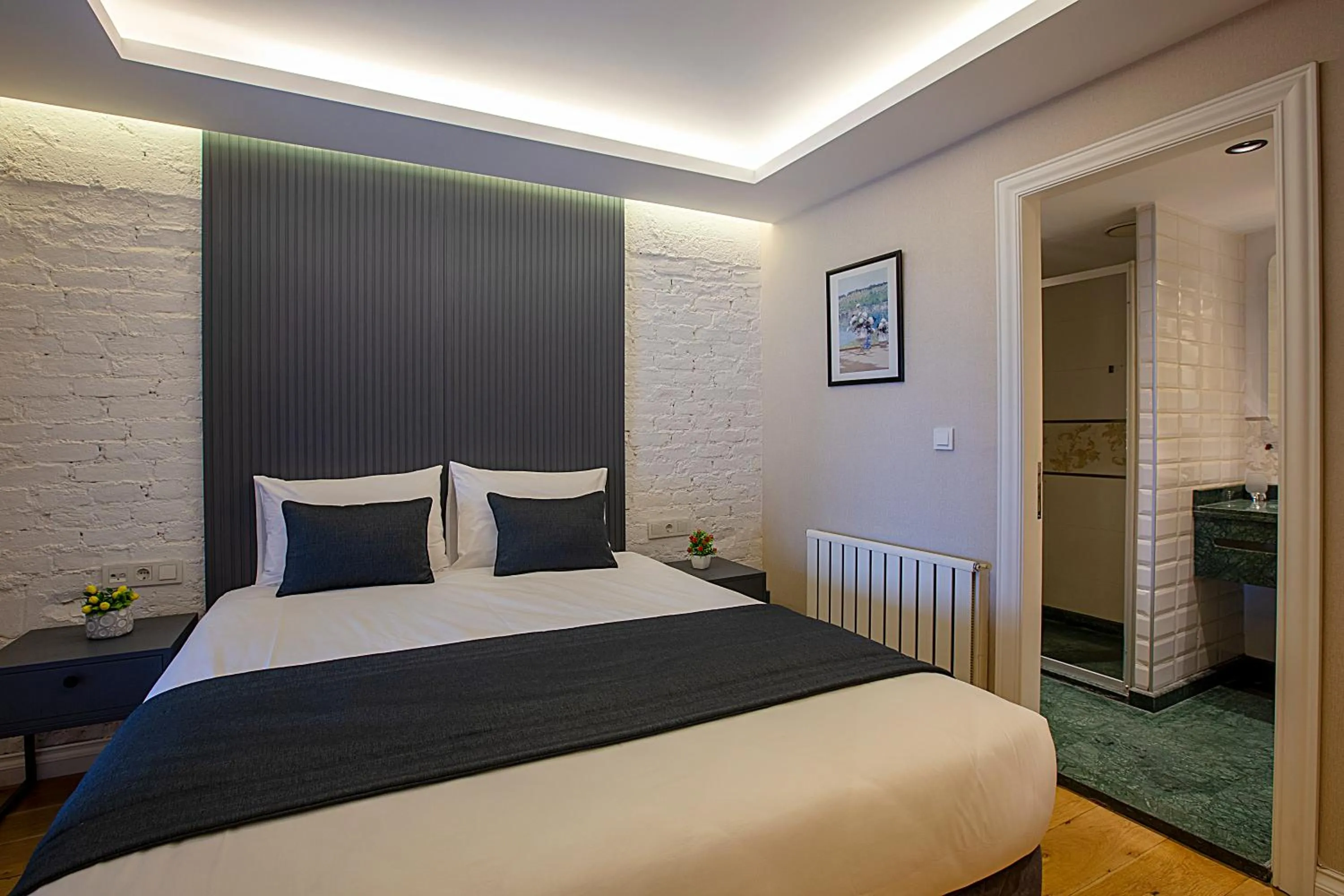 Bed in Moss Suites Hotel