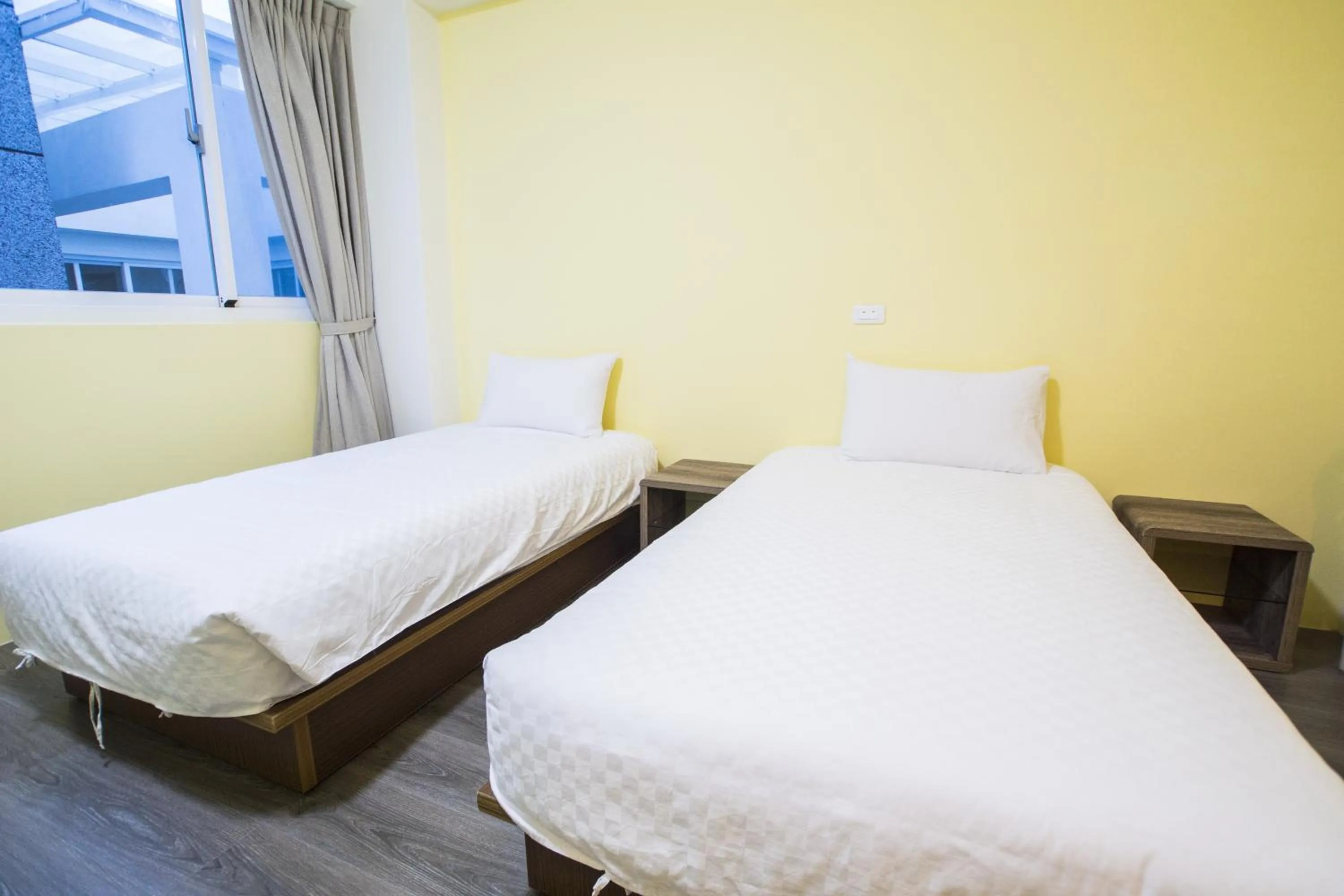 Bed in Siang Jhan B&B