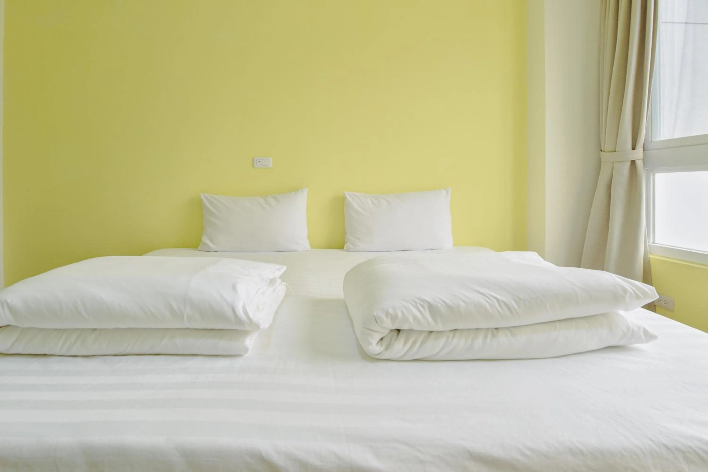 Bed in Siang Jhan B&B