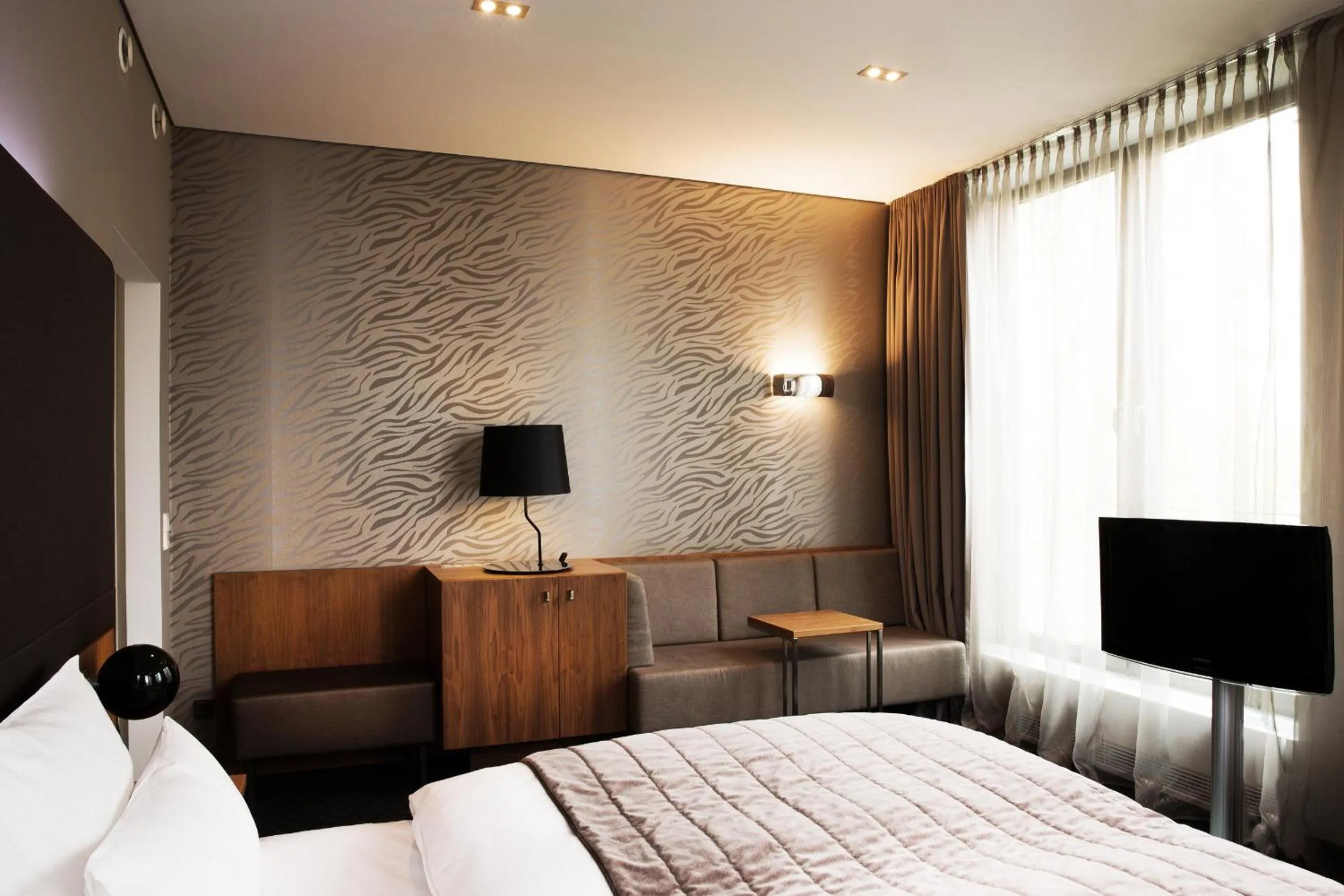 Photo of the whole room, Bed in COSMO Hotel Berlin Mitte