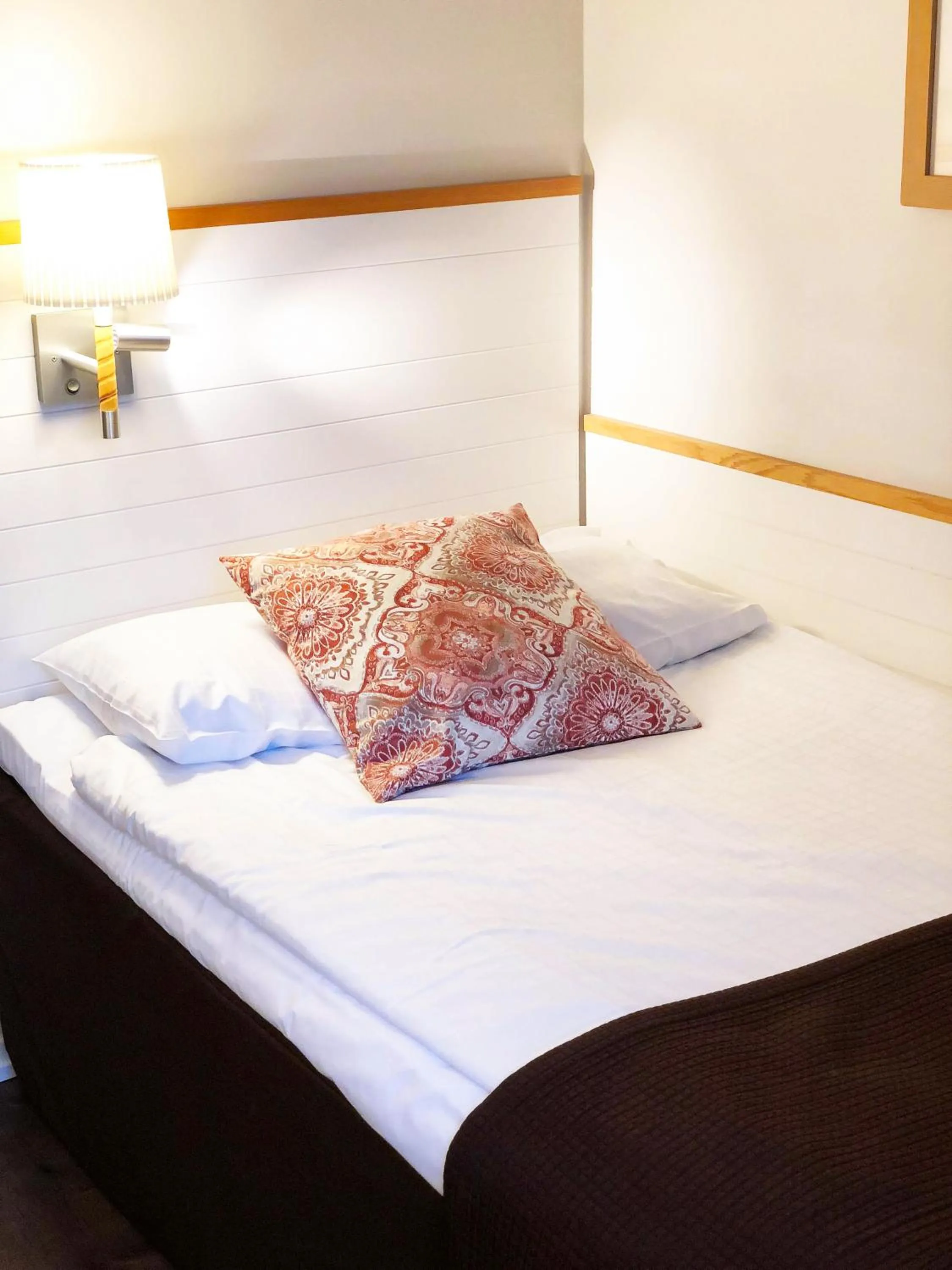 Bed in Clarion Collection Hotel Smedjan