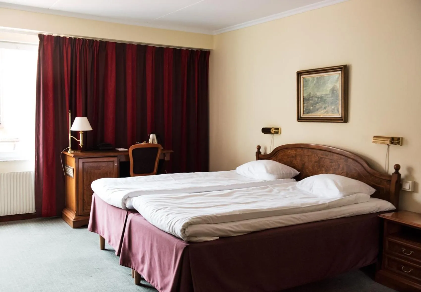 Bed in Clarion Collection Hotel Smedjan