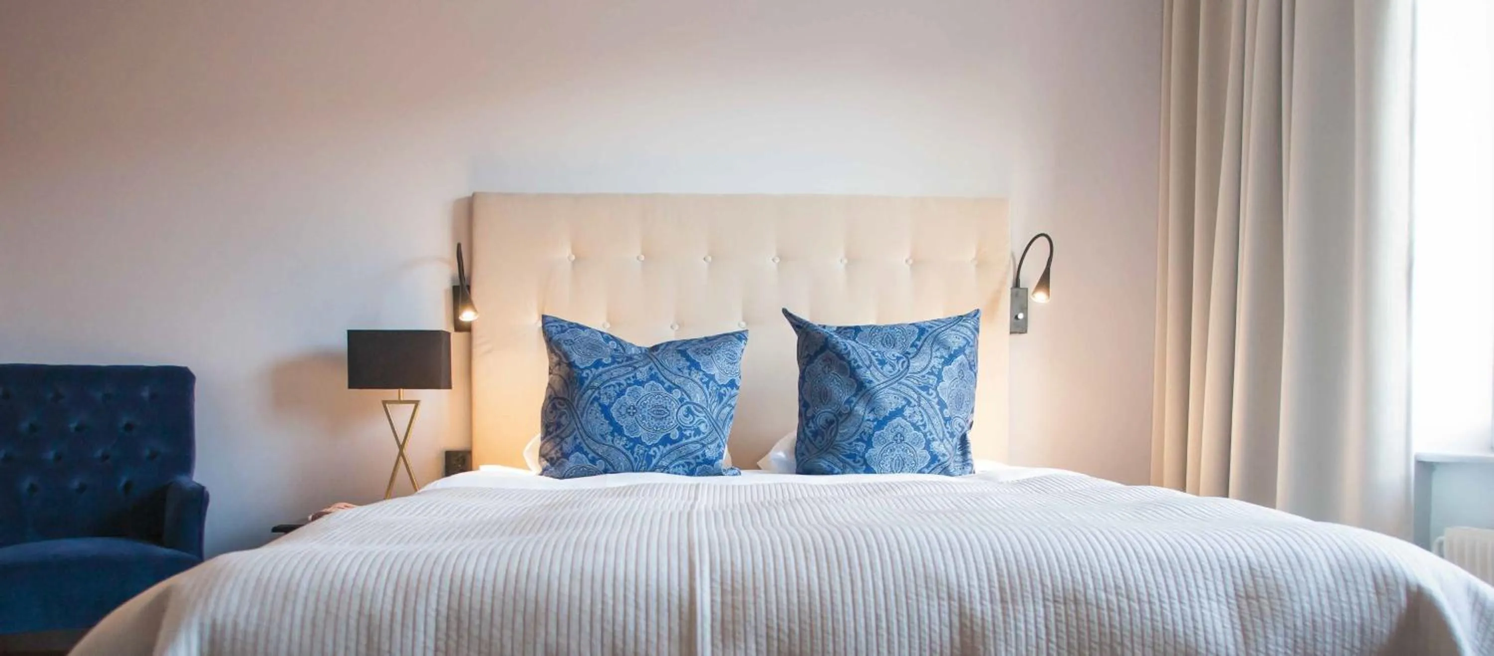 Bed in Clarion Collection Hotel Smedjan