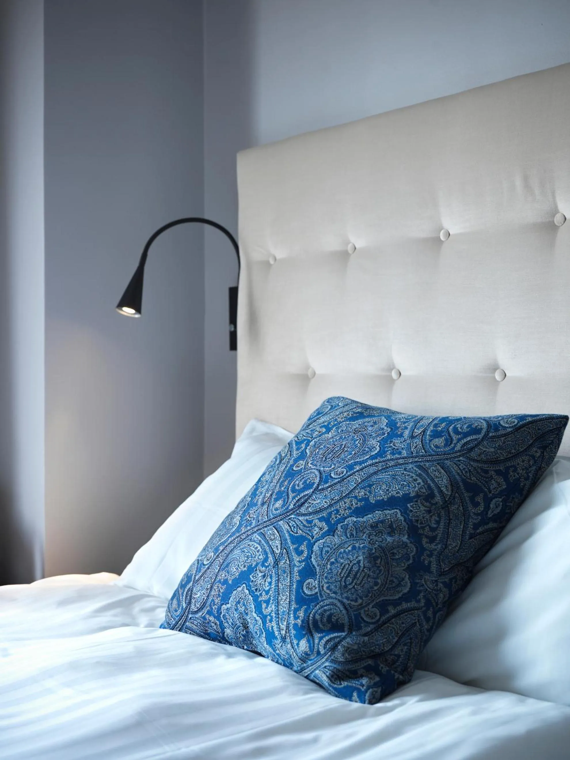 Bed in Clarion Collection Hotel Smedjan