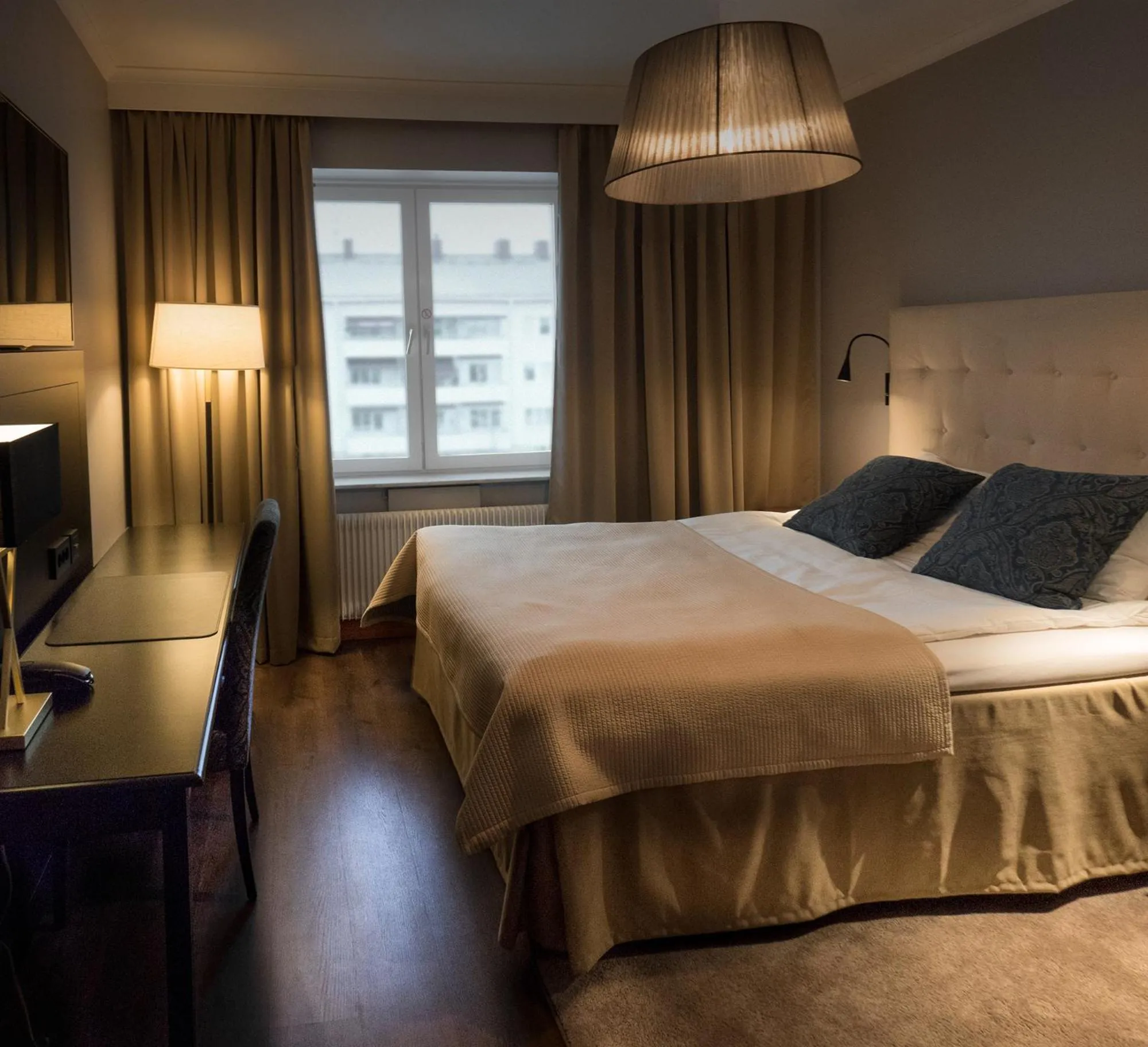 Bed in Clarion Collection Hotel Smedjan