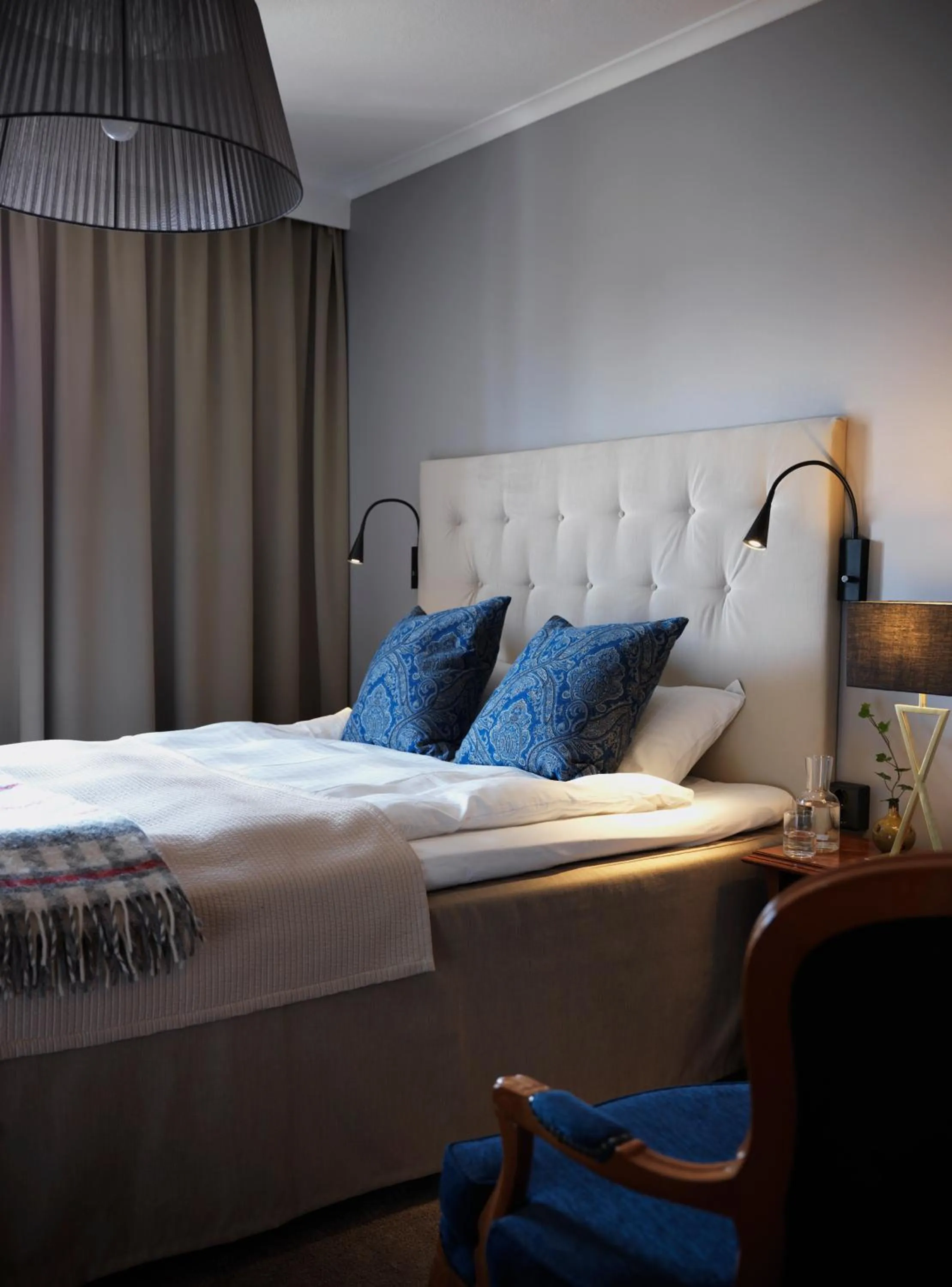 Bed in Clarion Collection Hotel Smedjan