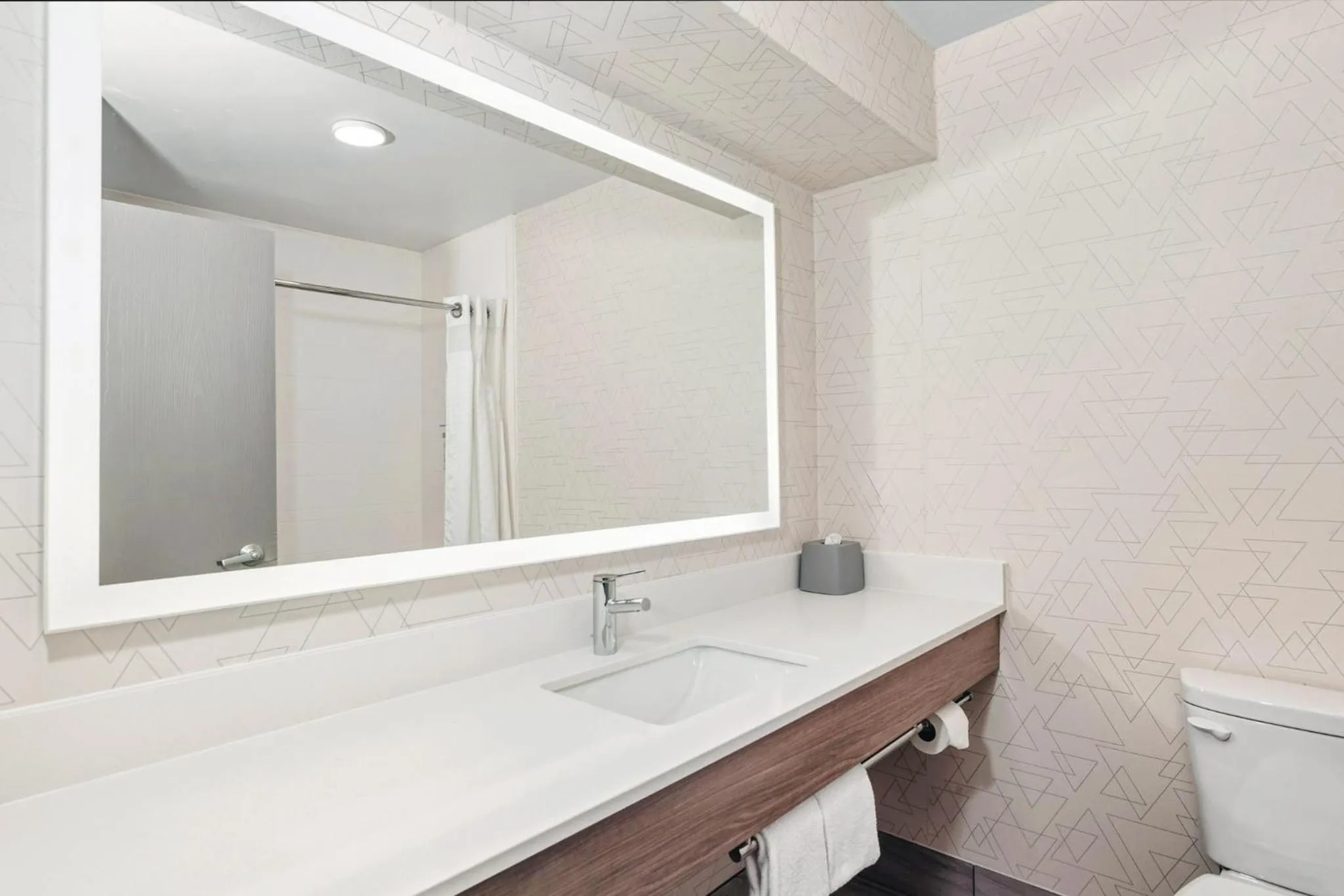 Bathroom in Holiday Inn Express Hotel & Suites Bloomington-Normal University Area by IHG
