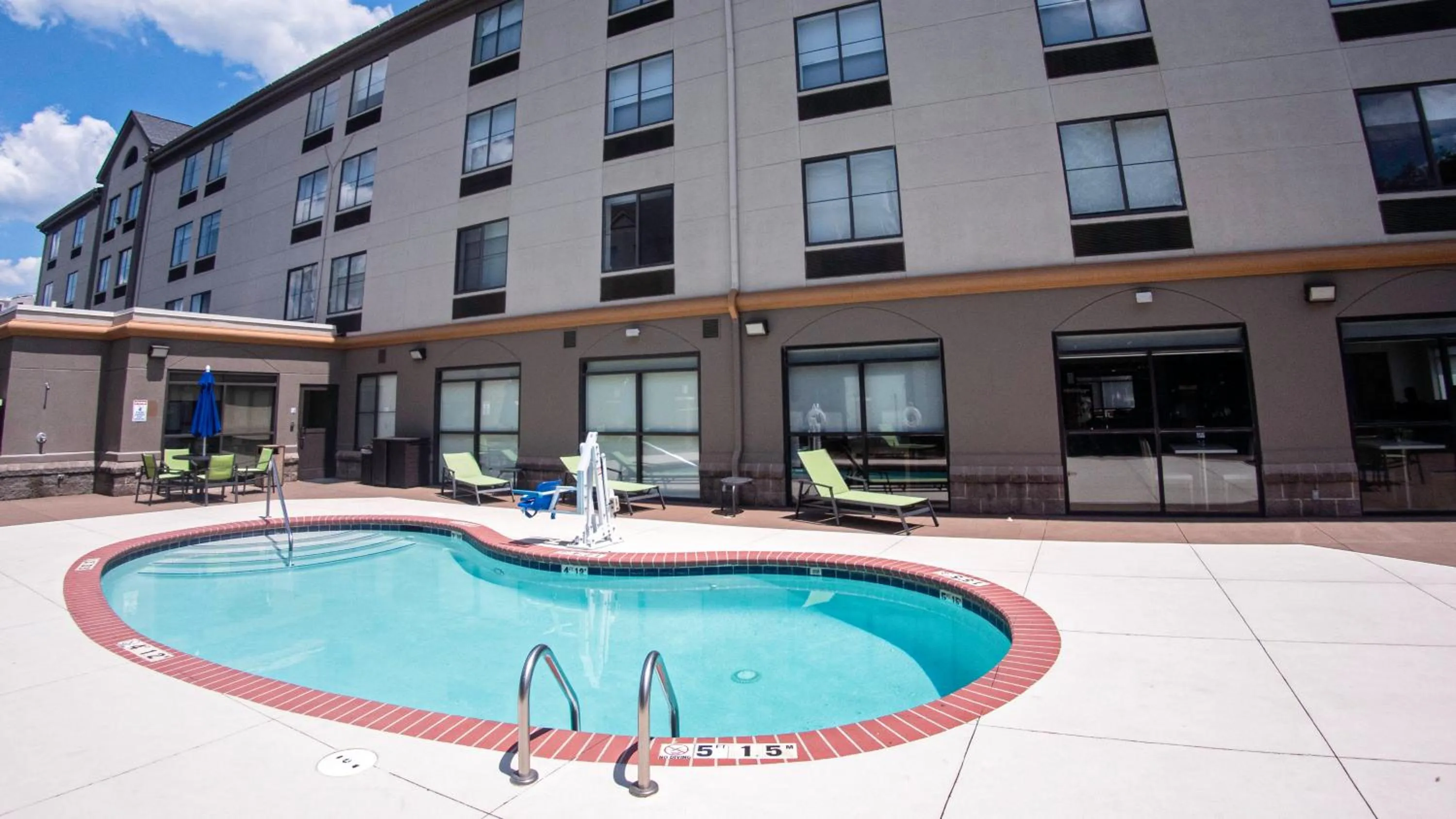 Swimming pool in Holiday Inn Express & Suites Charlotte-Concord-I-85 by IHG