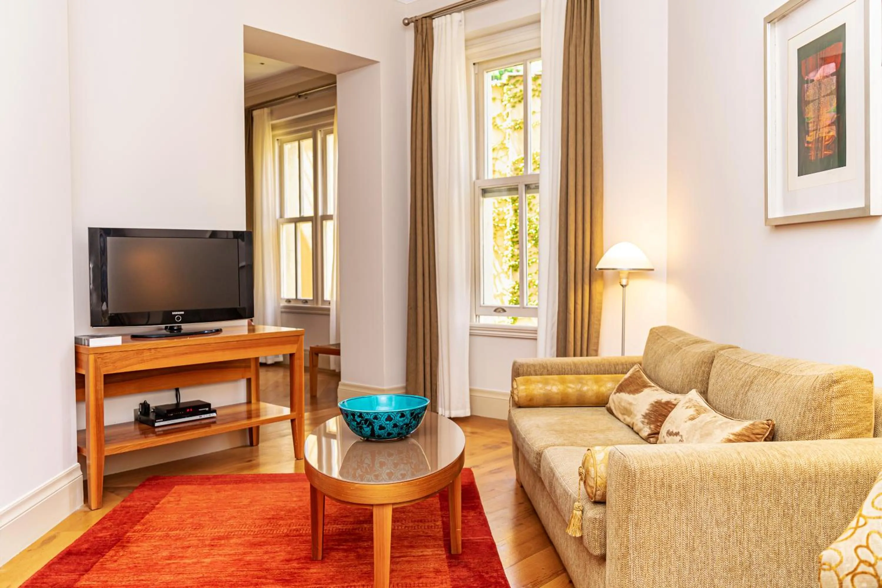 Communal lounge/ TV room in Tomtom Suites