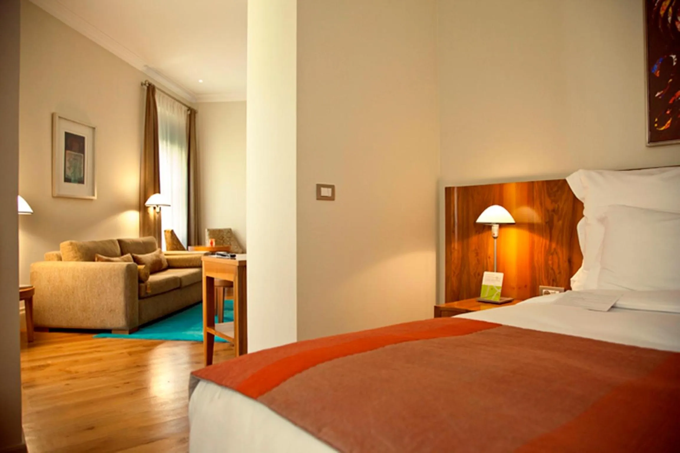 Photo of the whole room, Bed in Tomtom Suites