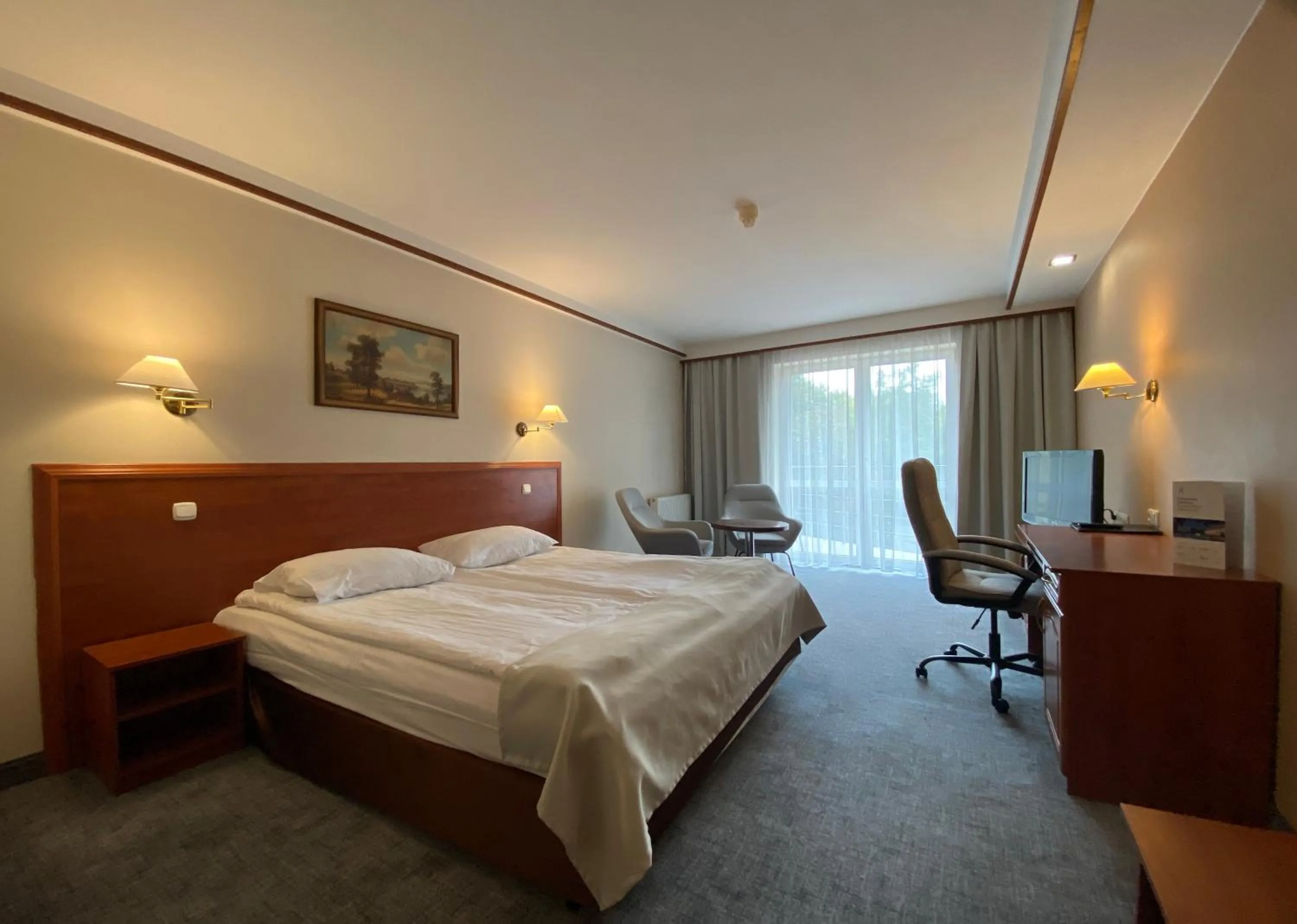 Property building, Bed in Hotel Ambasador Chojny