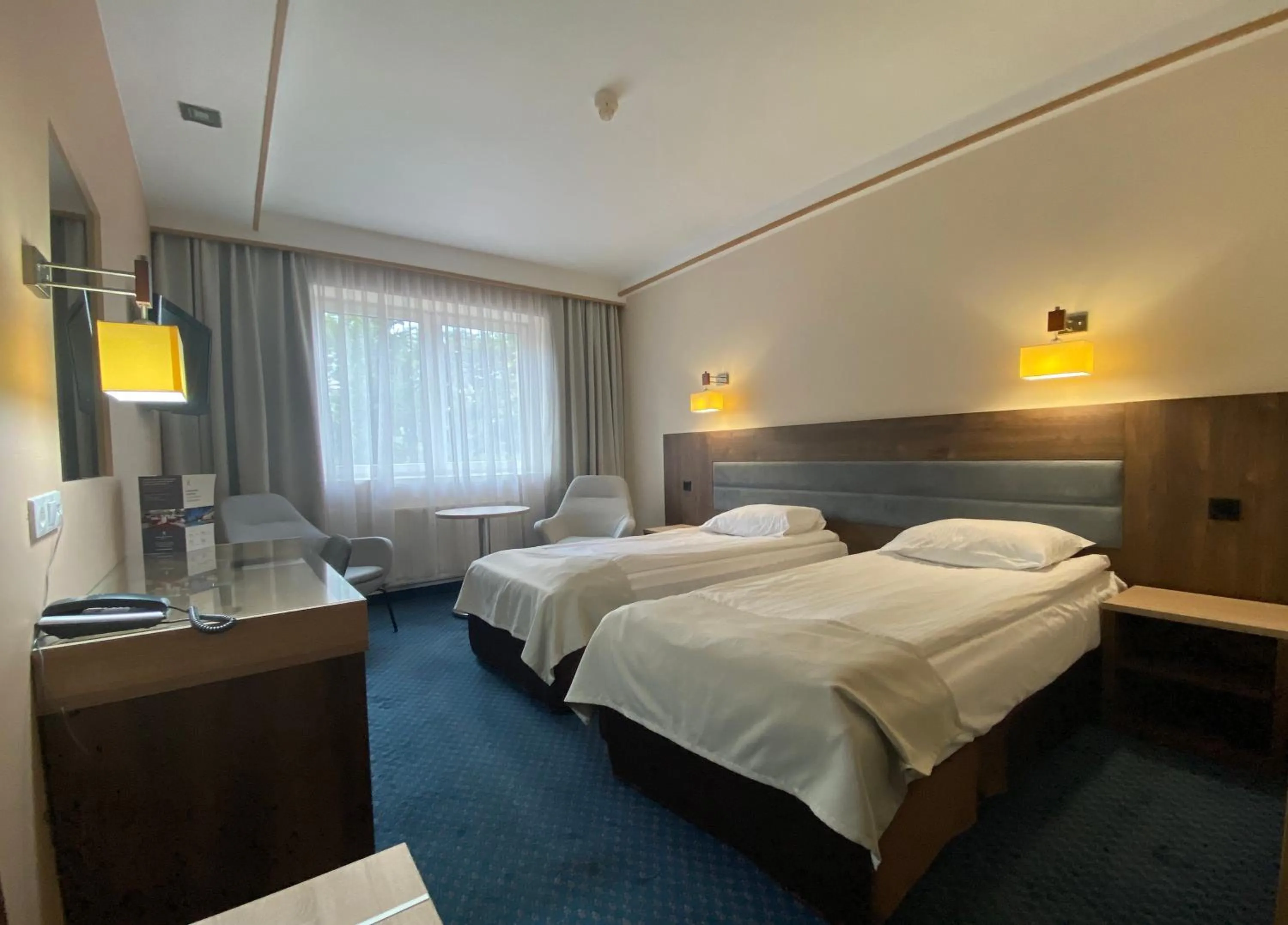 Property building, Bed in Hotel Ambasador Chojny