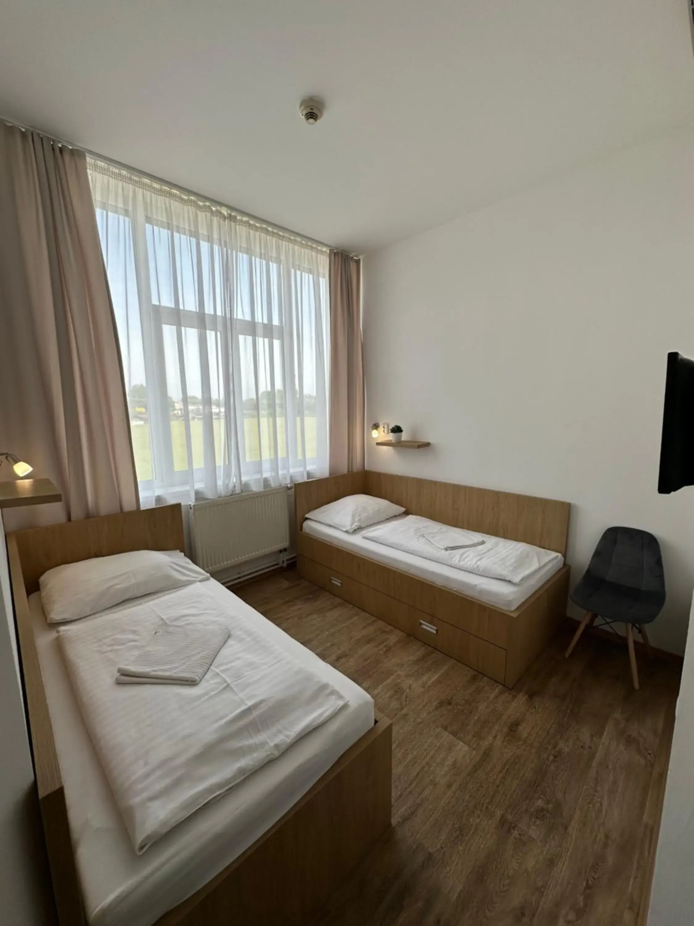 Triple Room with Private Bathroom in Penzion Raketa Bowling Triple Room with Private Bathroom in Penzion Raketa Bowling